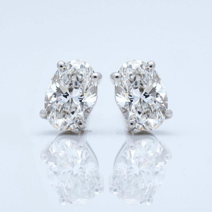 Front view of oval diamond stud earrings with clarity in white gold.