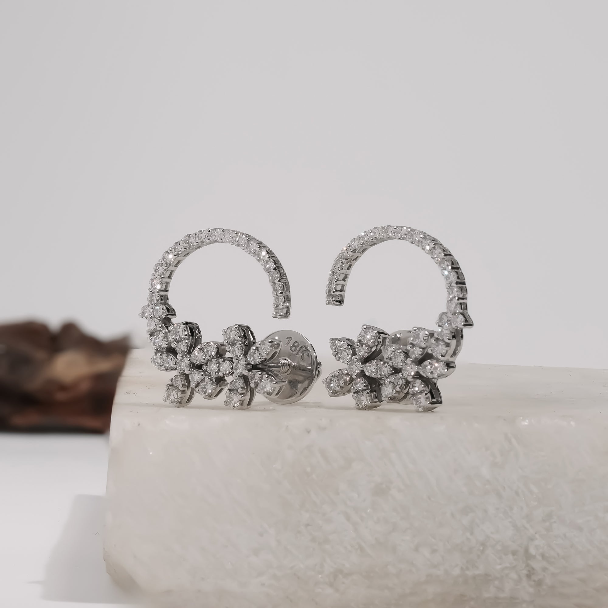 Elegant Rosalie Floral Hoop Earrings in white gold, featuring lab-grown diamonds, showcasing delicate floral artistry.
