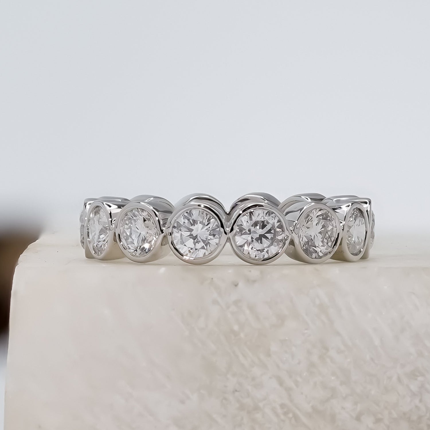 Diamond ring on a white stone with a blurred background