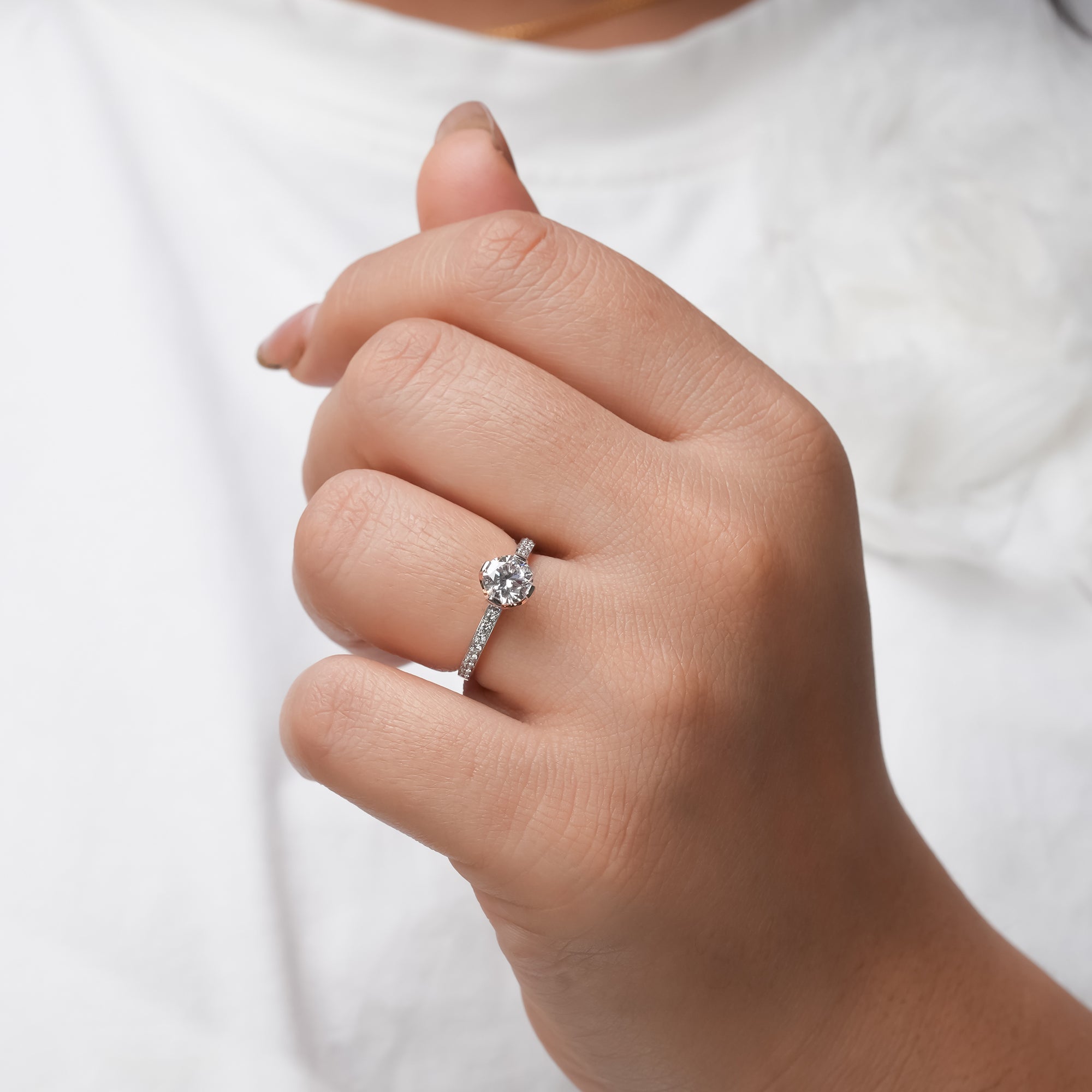 A timeless engagement ring with a dazzling round diamond that captures elegance and everlasting love.