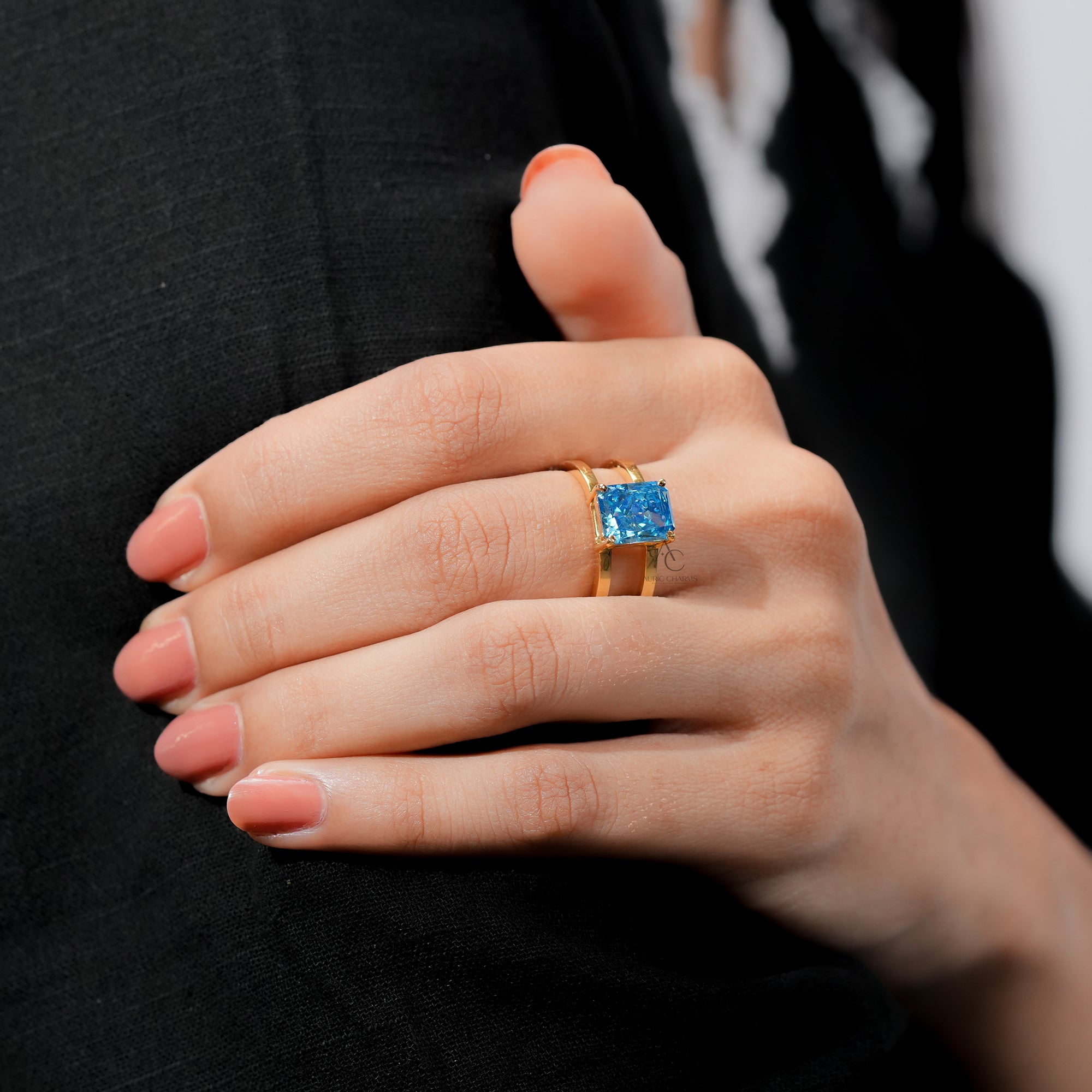 Fine jewelry gold ring with bright blue gemstone for women.