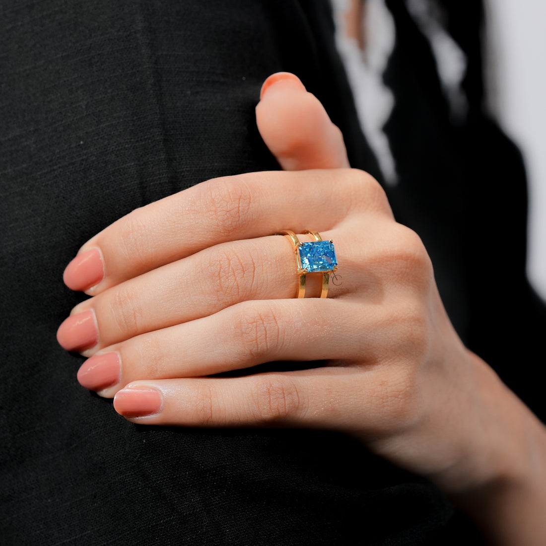 Fine jewelry gold ring with bright blue gemstone for women.