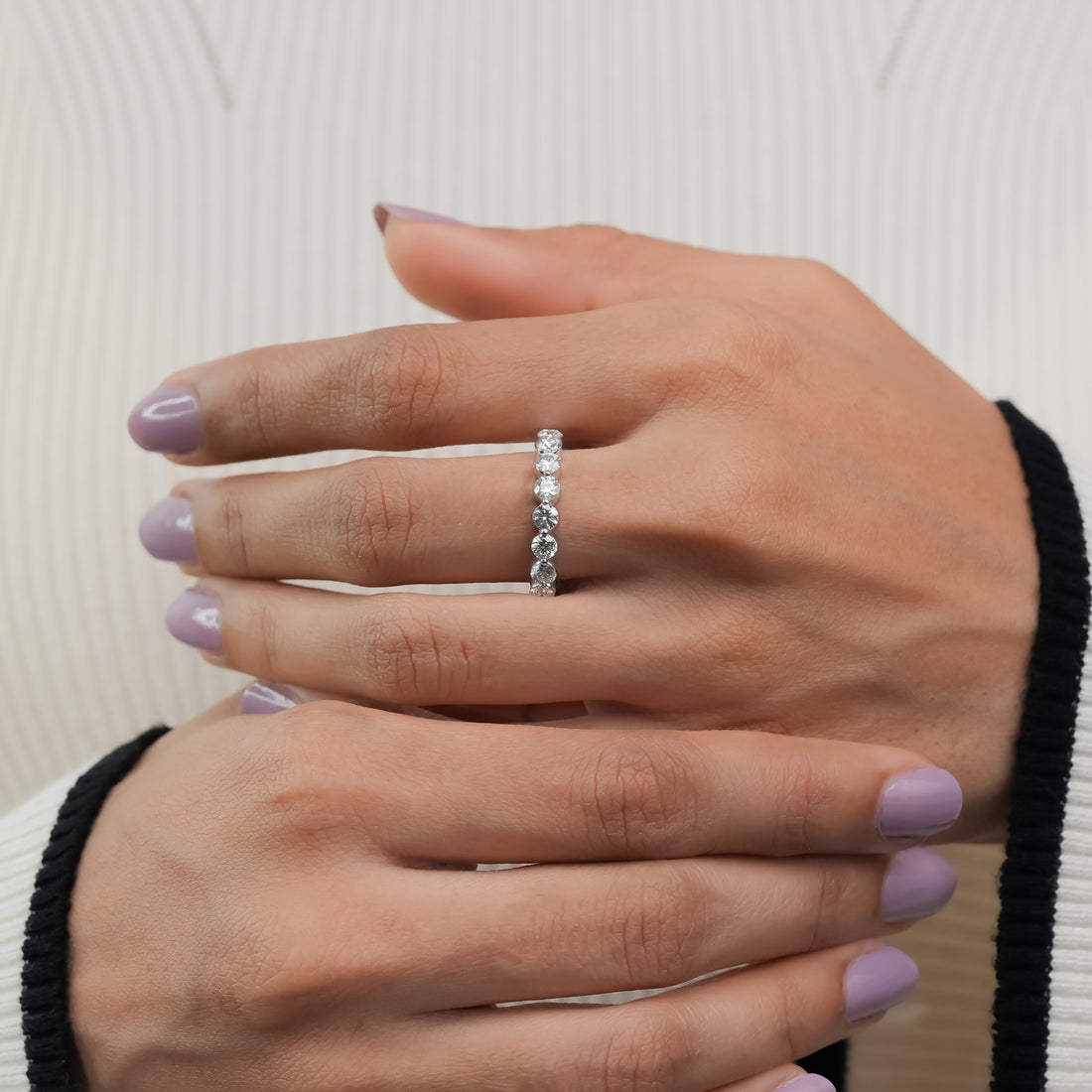 Round diamond eternity band in luminous white gold, symbolizing everlasting love and sophistication.
