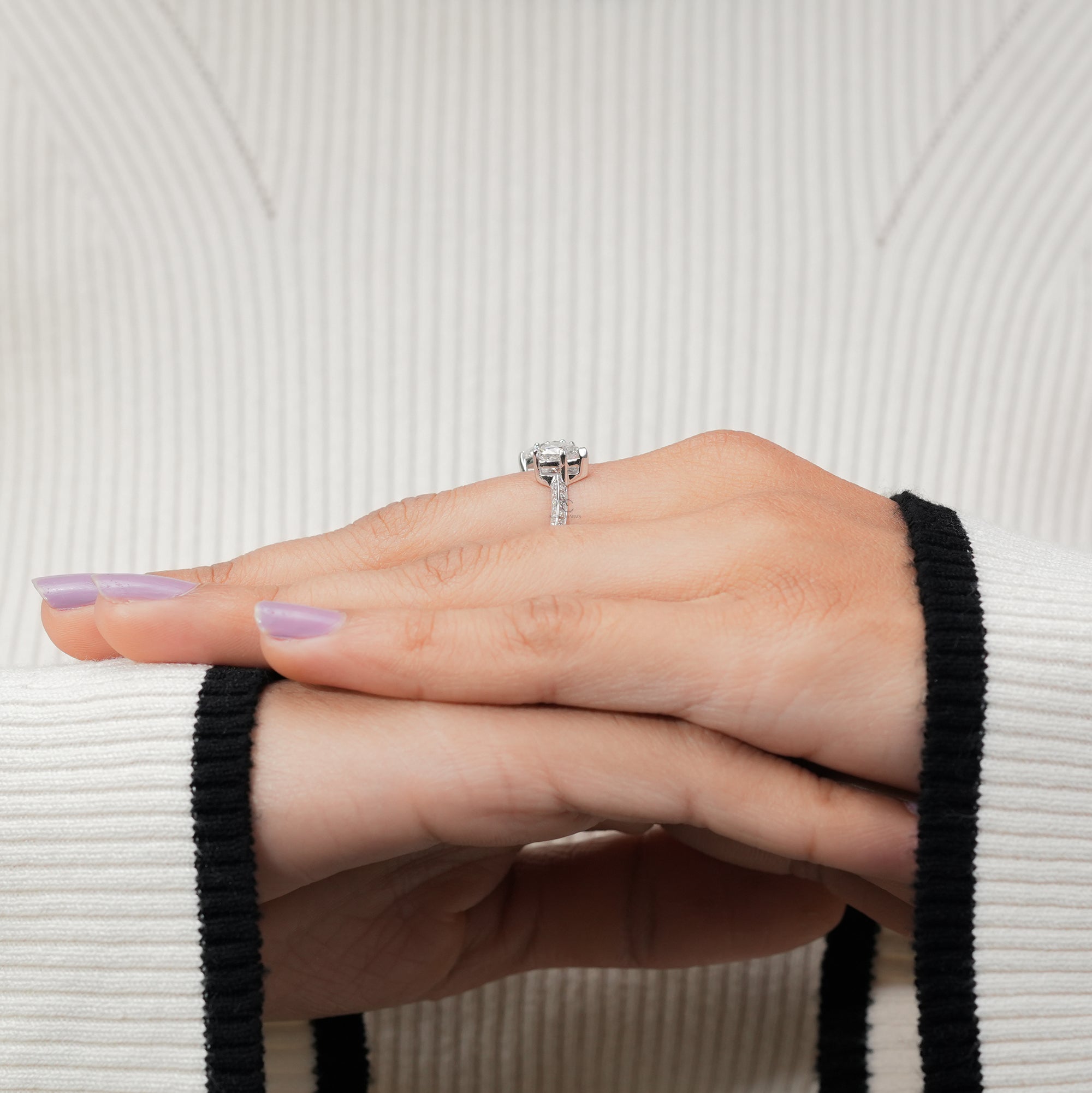Elegant sterling silver ring featuring two heart-cut diamonds.