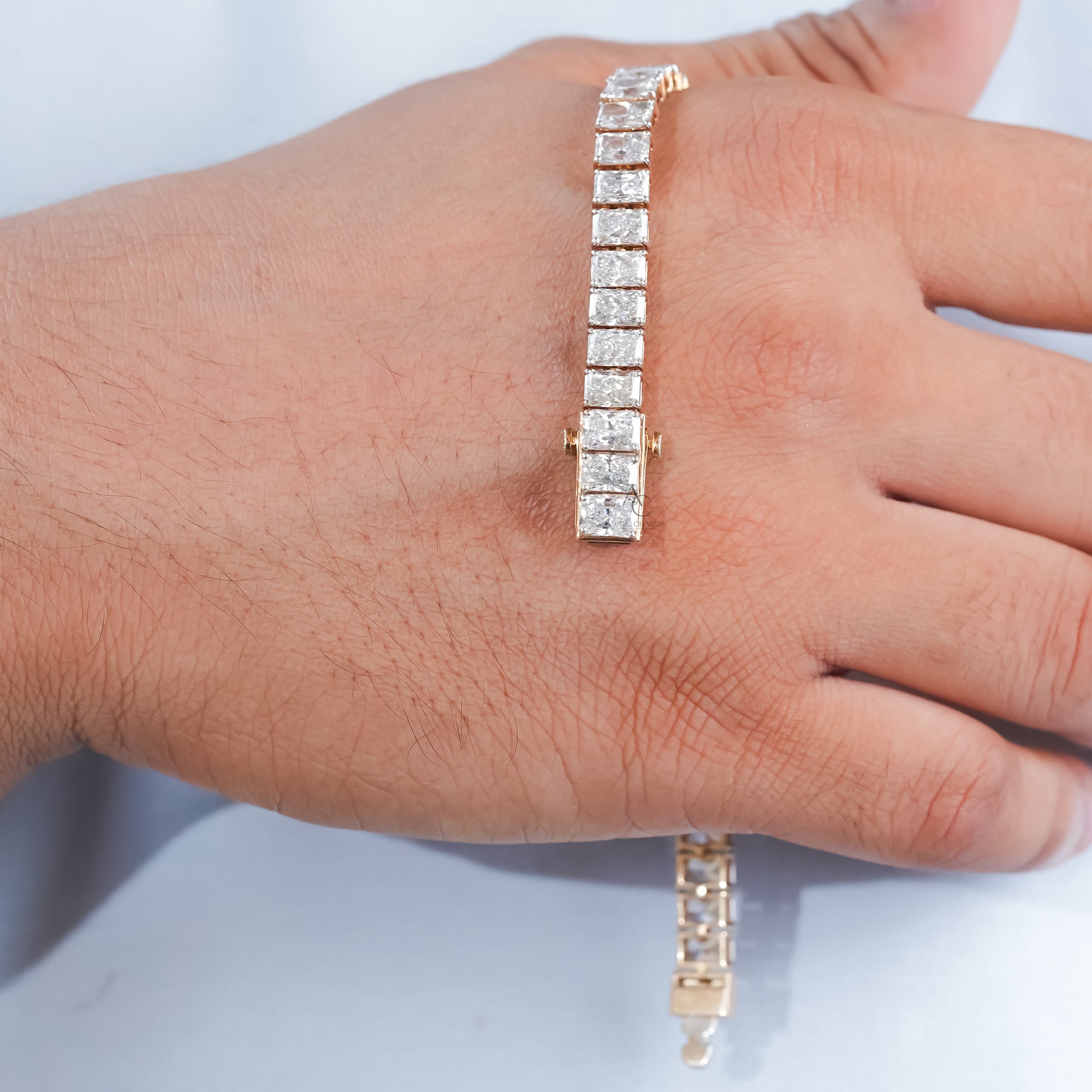 A dazzling gold diamond bracelet with geometric precision, each radiant cut diamond reflecting light in harmony, creating a statement of elegance and luxury.