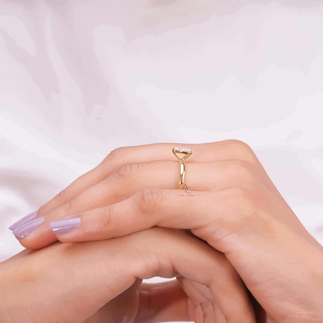Lyra Pear Cut Solitaire Diamond Ring