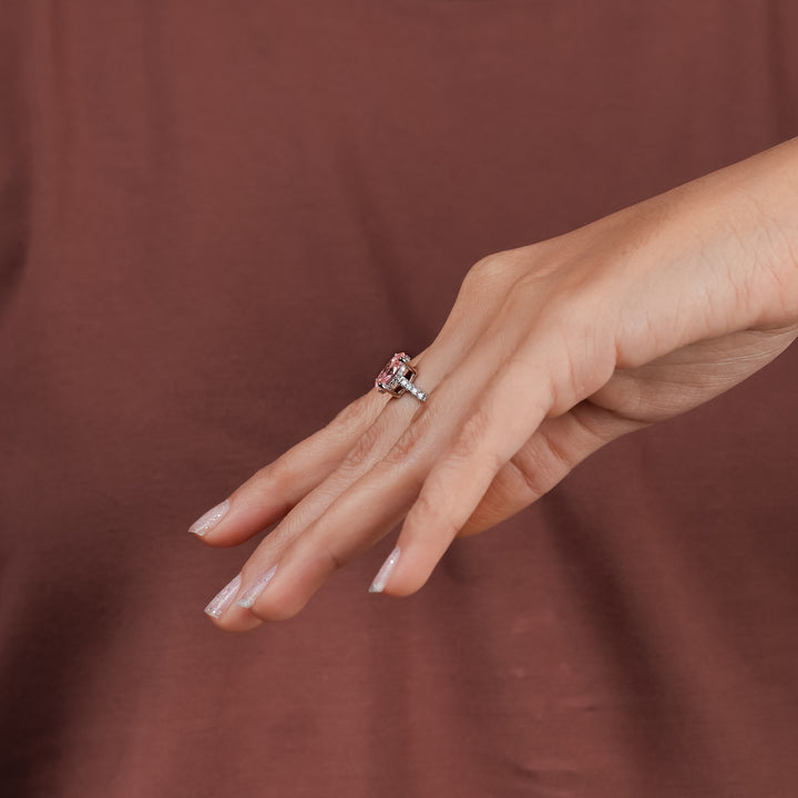 Delicate oval pink diamond ring with dazzling pavé band a perfect blend of romance and modern style.