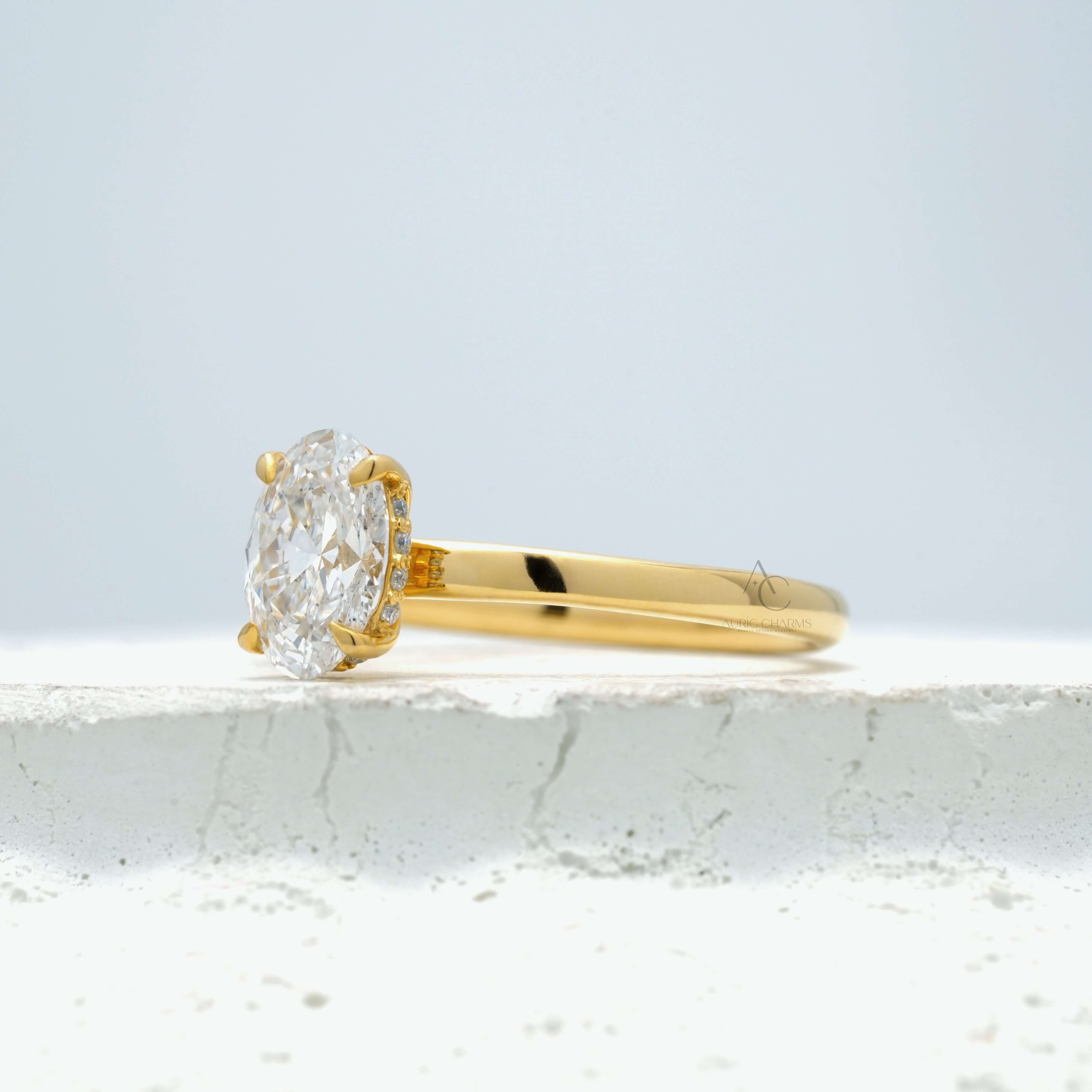 Side profile of an oval-cut solitaire diamond ring showcasing the prong setting.