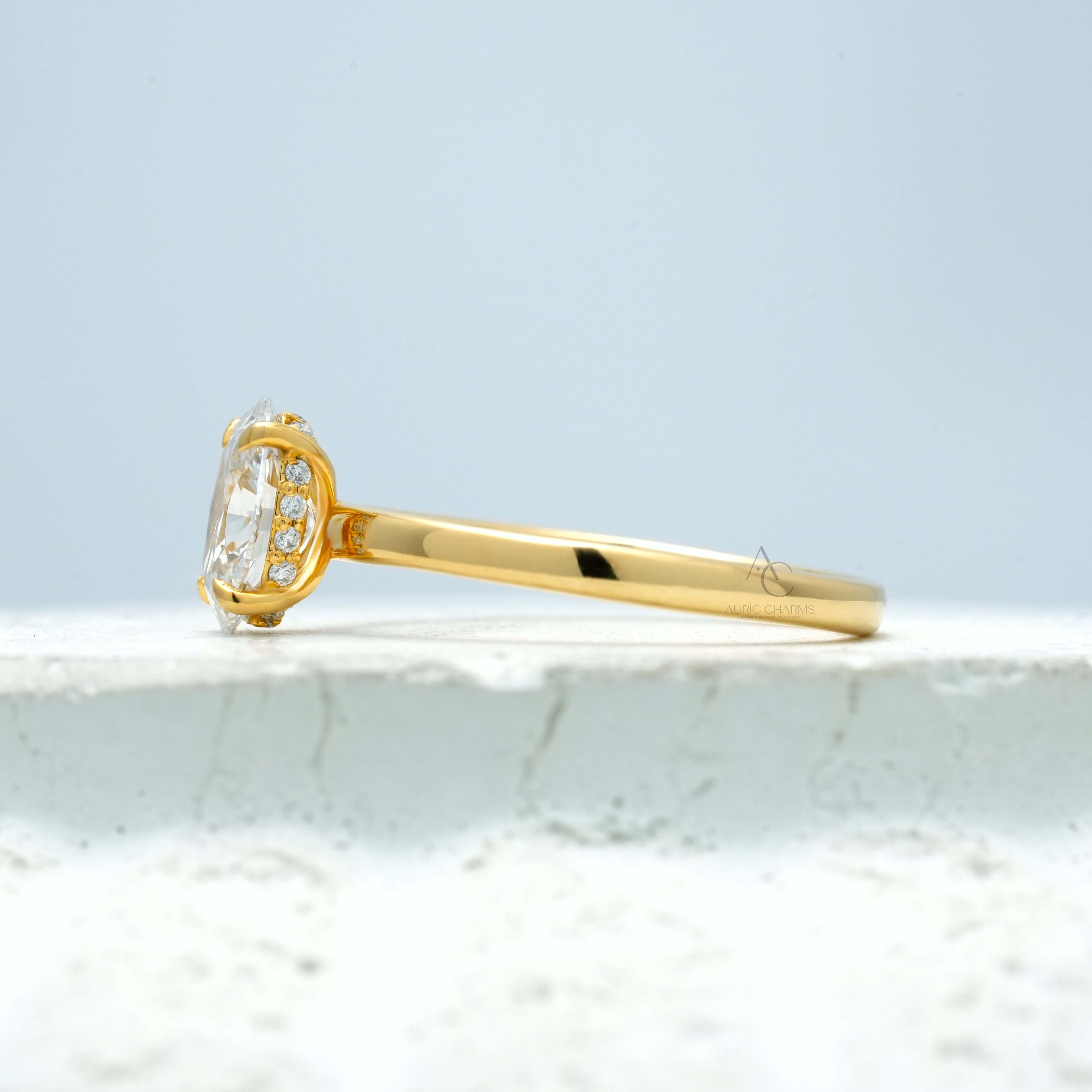 Close-up view of an oval-cut diamond ring with a minimalist metal band design.