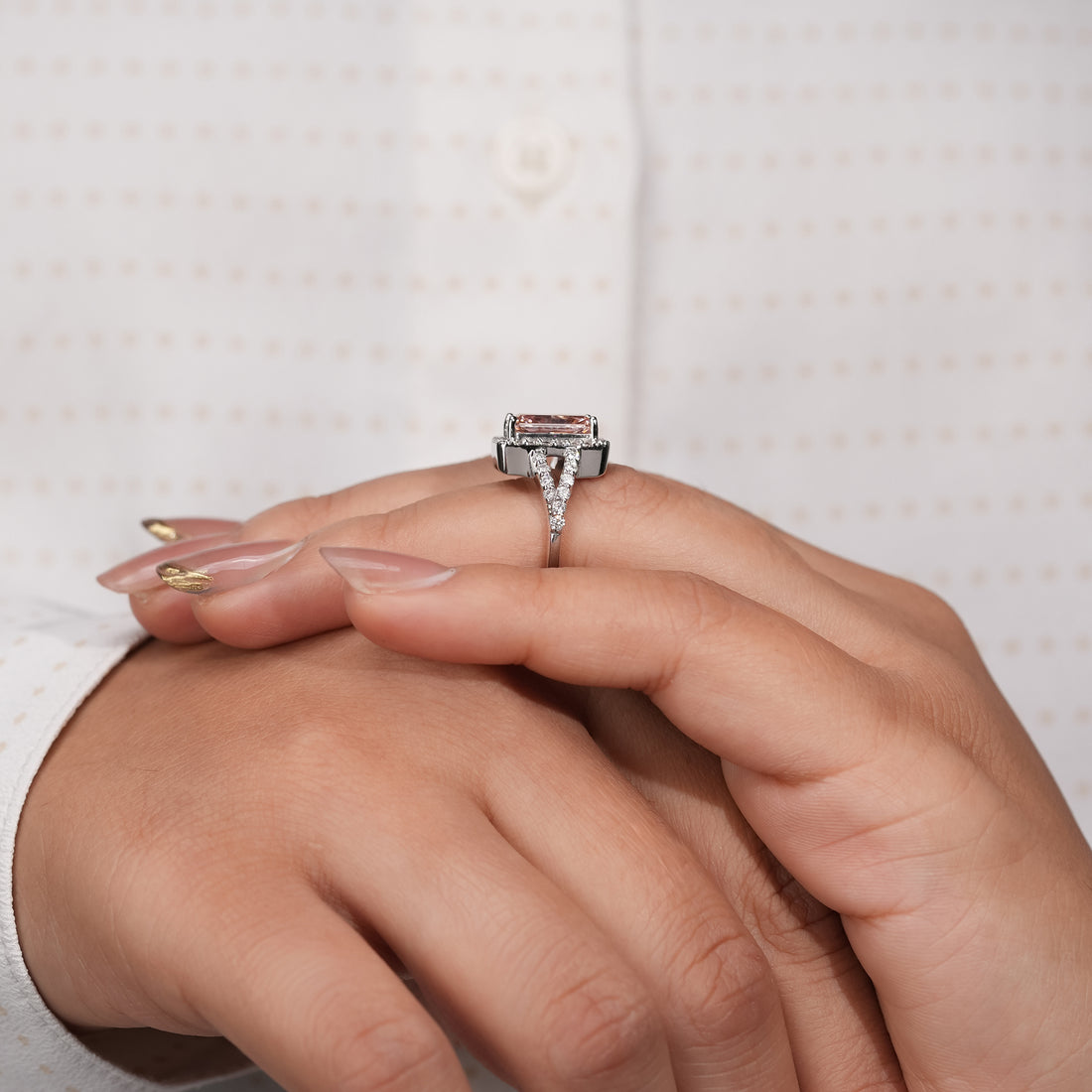Rectangular radiant-cut pink diamond ring, halo setting, pavé split shank, crafted in polished white gold.