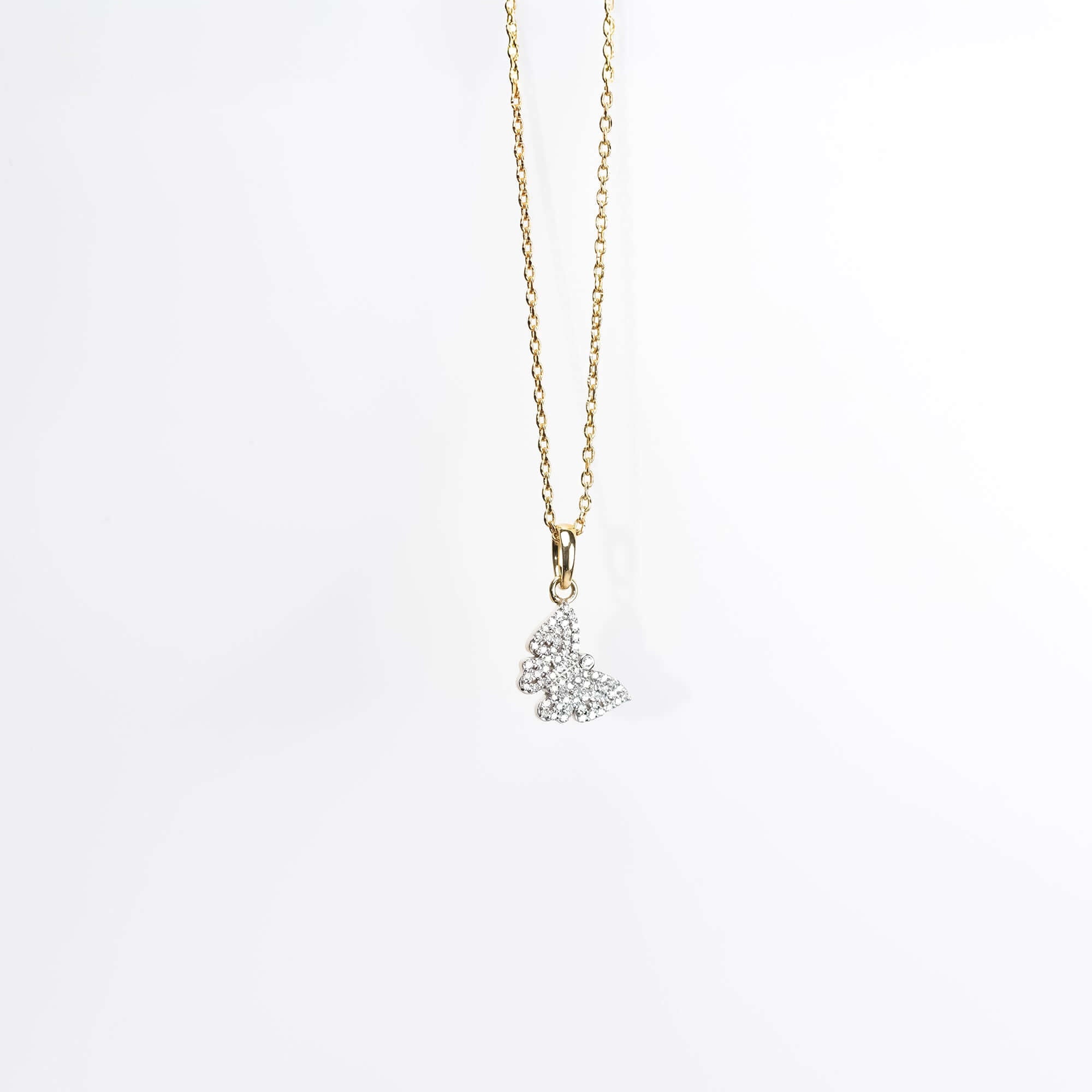 Gold butterfly pendant necklace with diamond detailing