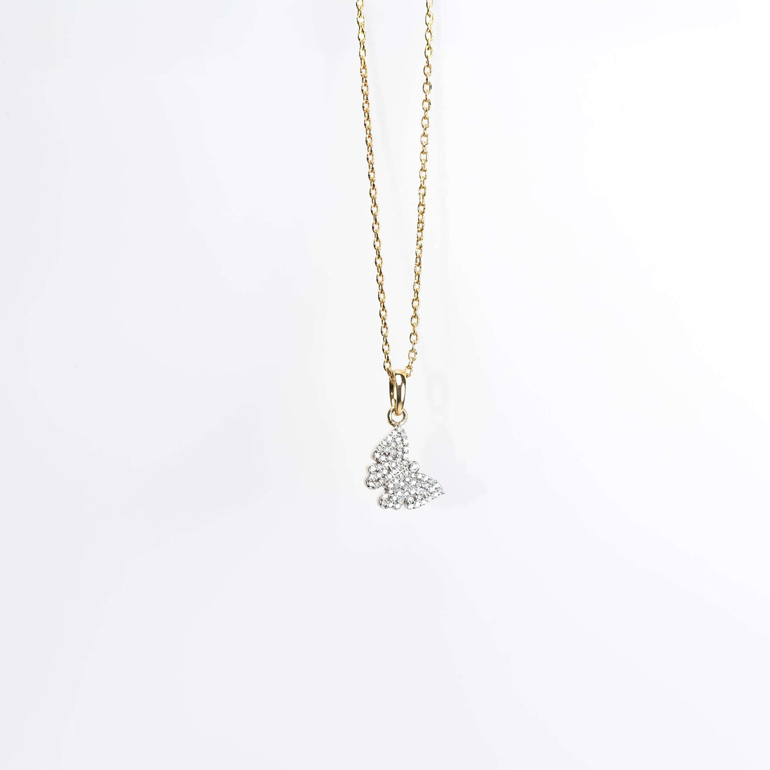 Gold butterfly pendant necklace with diamond detailing