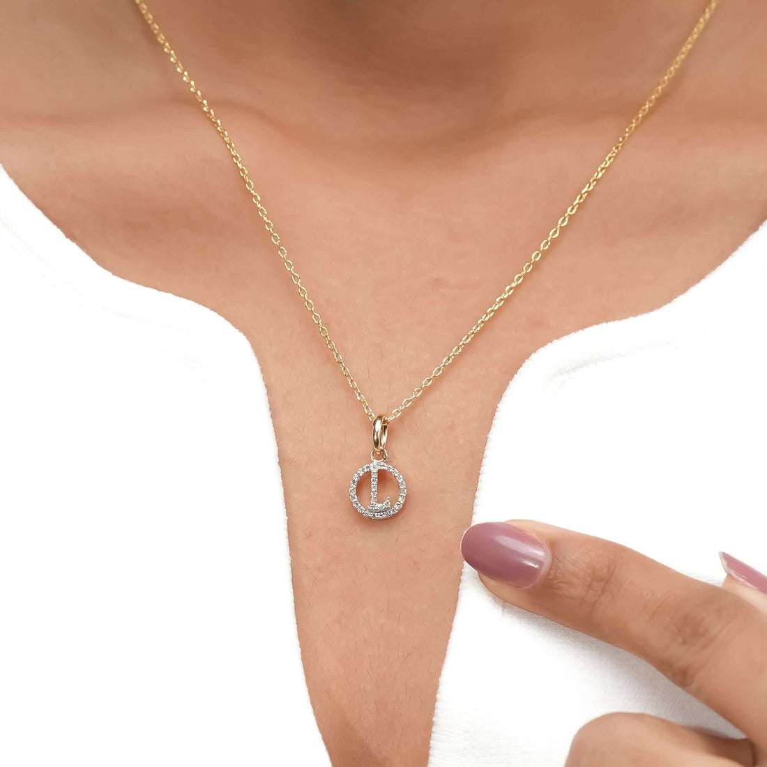 An elegant gold chain necklace featuring a sparkling diamond circle pendant, crafted for those who appreciate understated luxury.