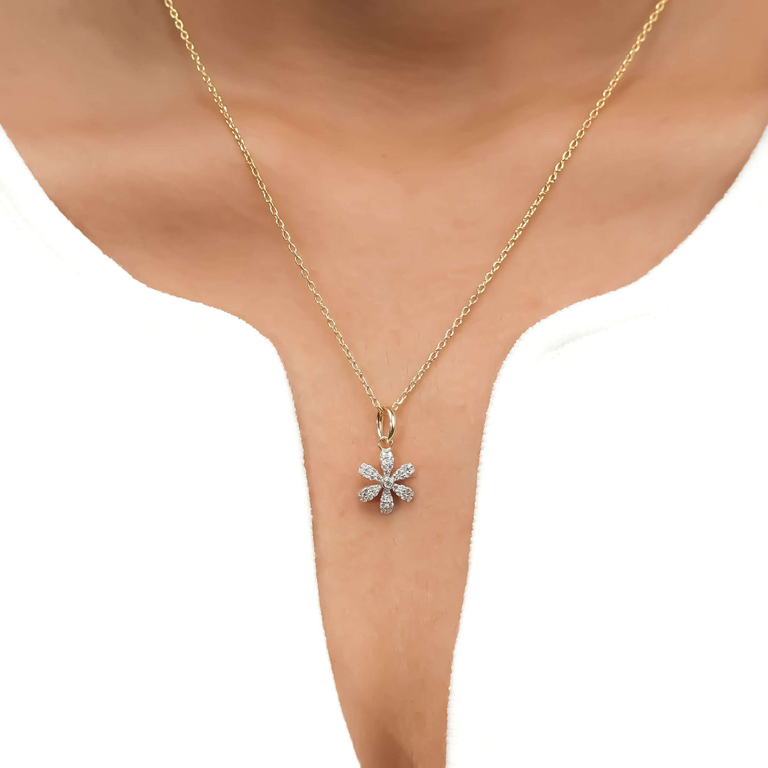 Gold flower pendant necklace with diamond detailing, featuring a daisy-inspired design perfect for everyday elegance or special occasions.