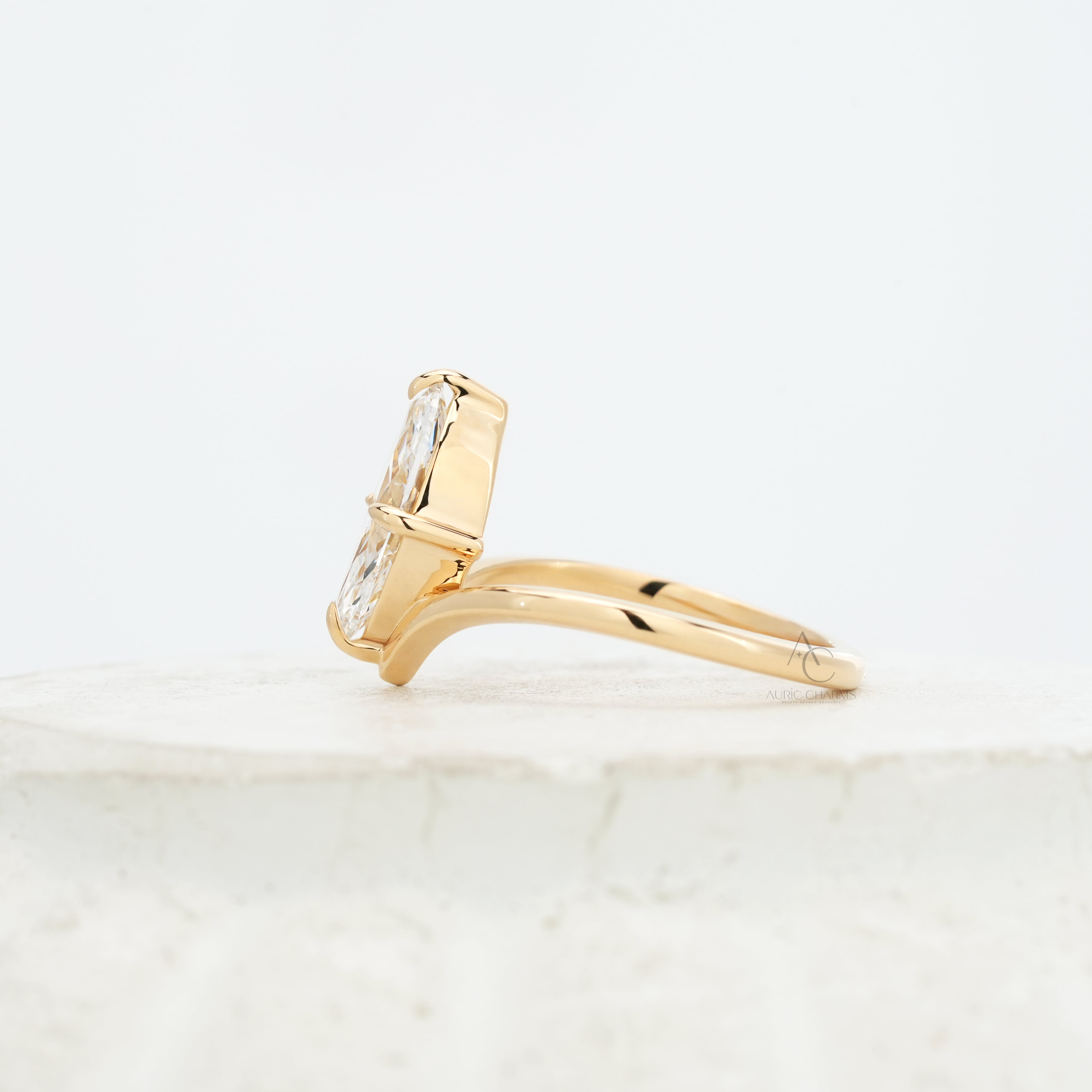 Side view of the Lyra Marquise Solitaire Lab Grown Diamond Ring, showcasing its elegant golden arc and minimalist silhouette.