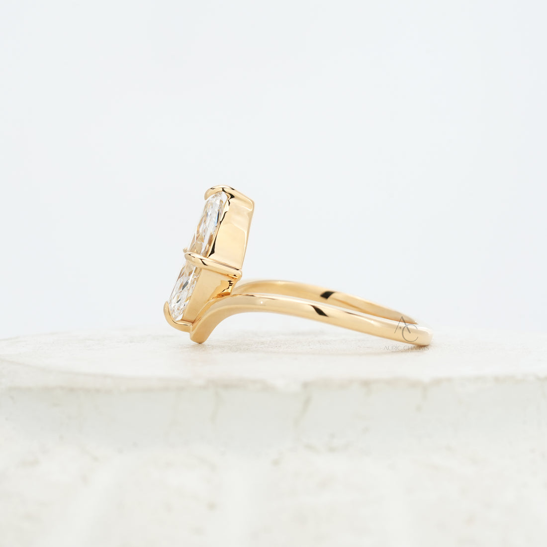 Side view of the Lyra Marquise Solitaire Lab Grown Diamond Ring, showcasing its elegant golden arc and minimalist silhouette.