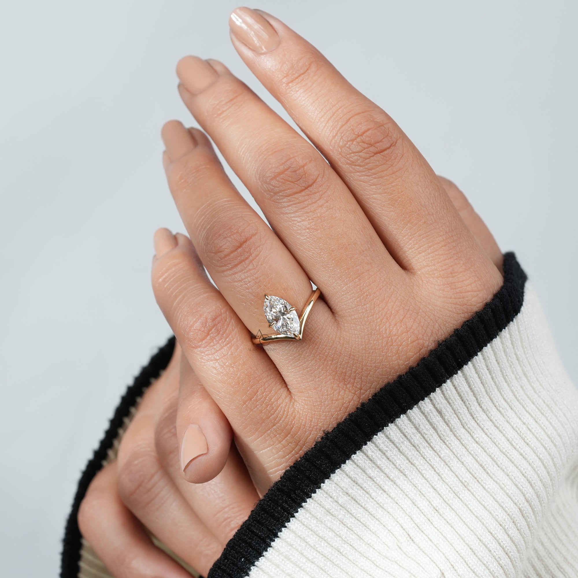 Lyra marquise solitaire lab-grown diamond ring showcased on a hand, radiating elegance in sustainable jewelry.