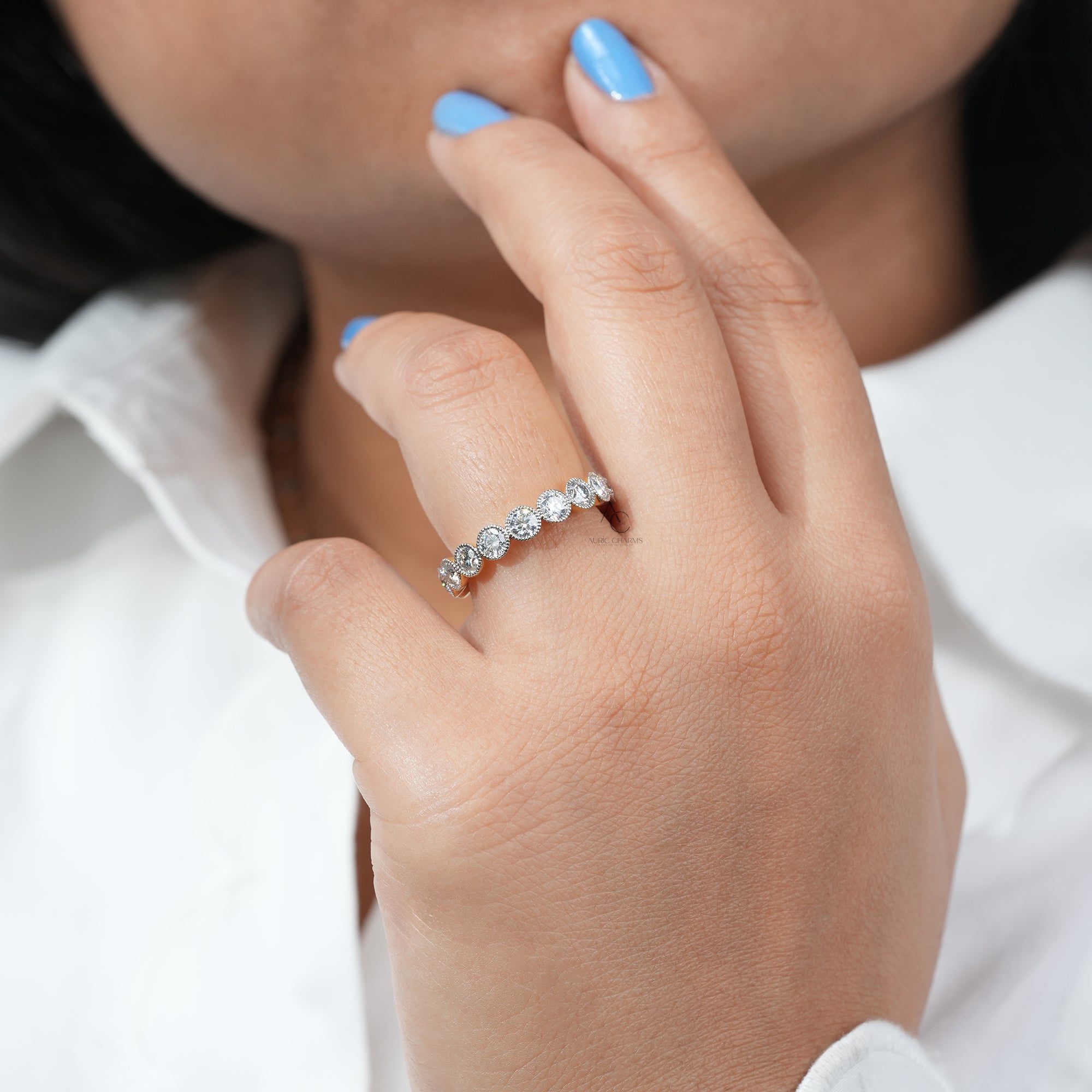 Model showcasing the Monroe Round Cut Bold Half Eternity Diamond Ring with lab-grown diamonds on her finger.