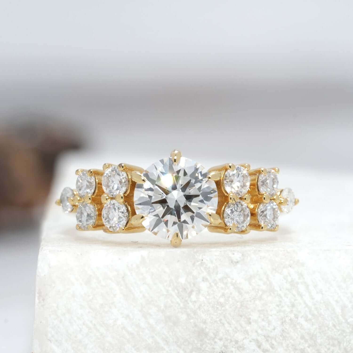 Round brilliant diamond solitaire ring with side diamond accents in platinum, reflective design