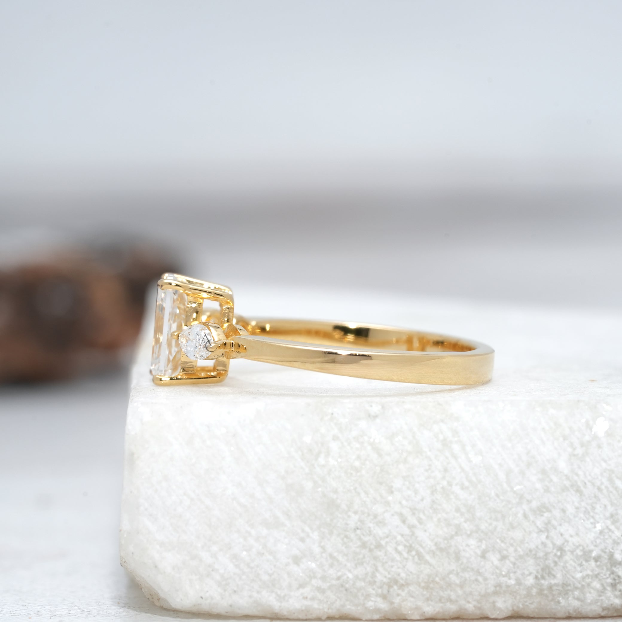 side view of a radiant cut diamond engagement ring with lab-grown diamonds and marquise side stones in a polished platinum setting.