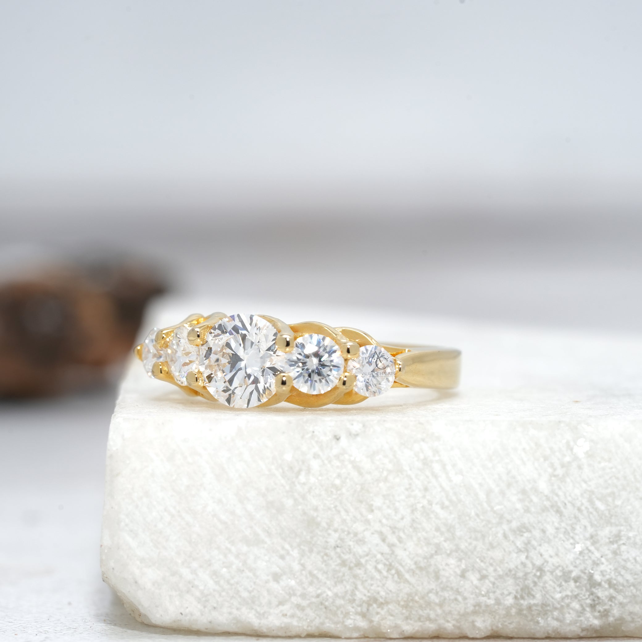 Elegant side view of a lab-grown diamond ring with interwoven design and round-cut diamonds.