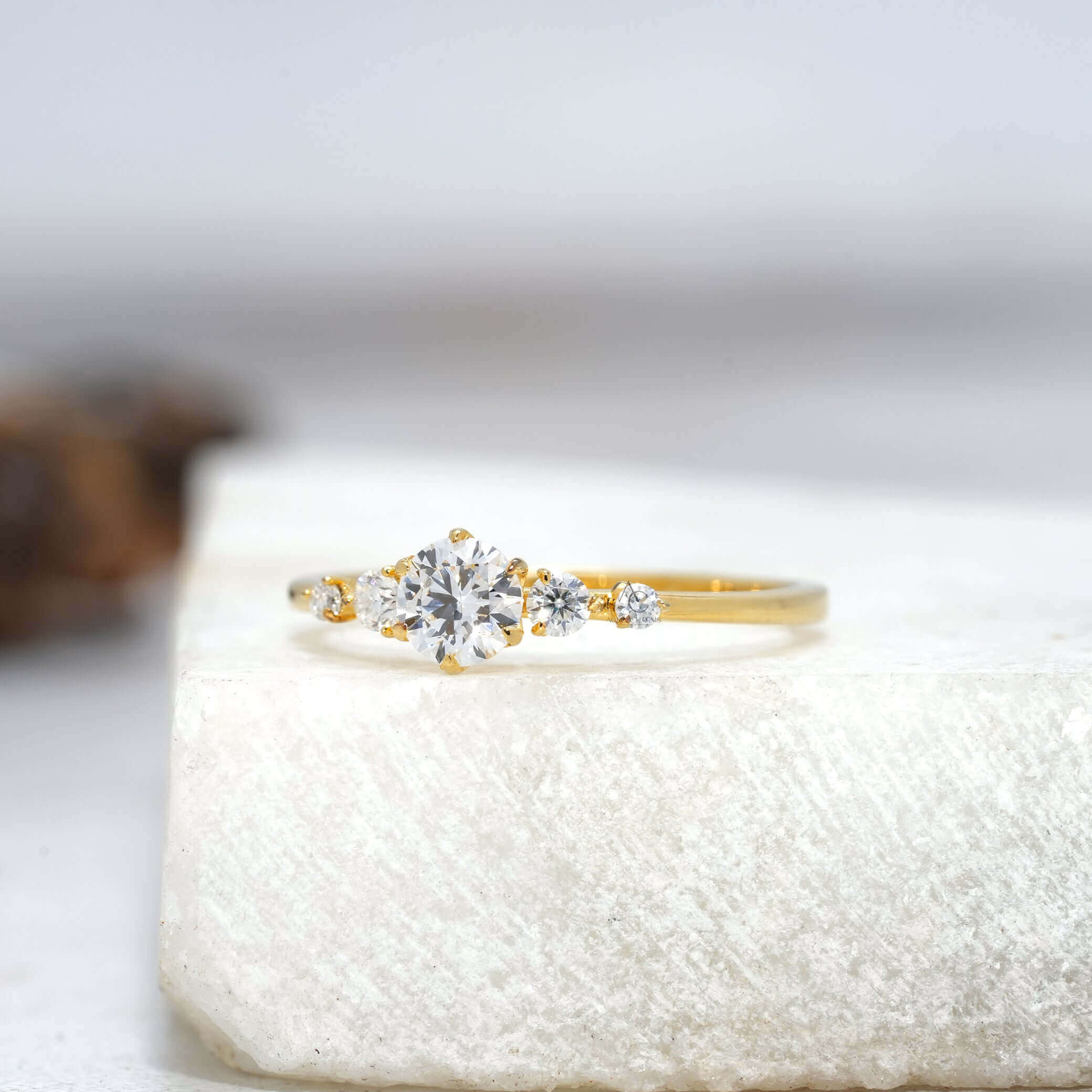 Side profile view of a diamond solitaire ring with a sleek band, perfect for modern elegance.