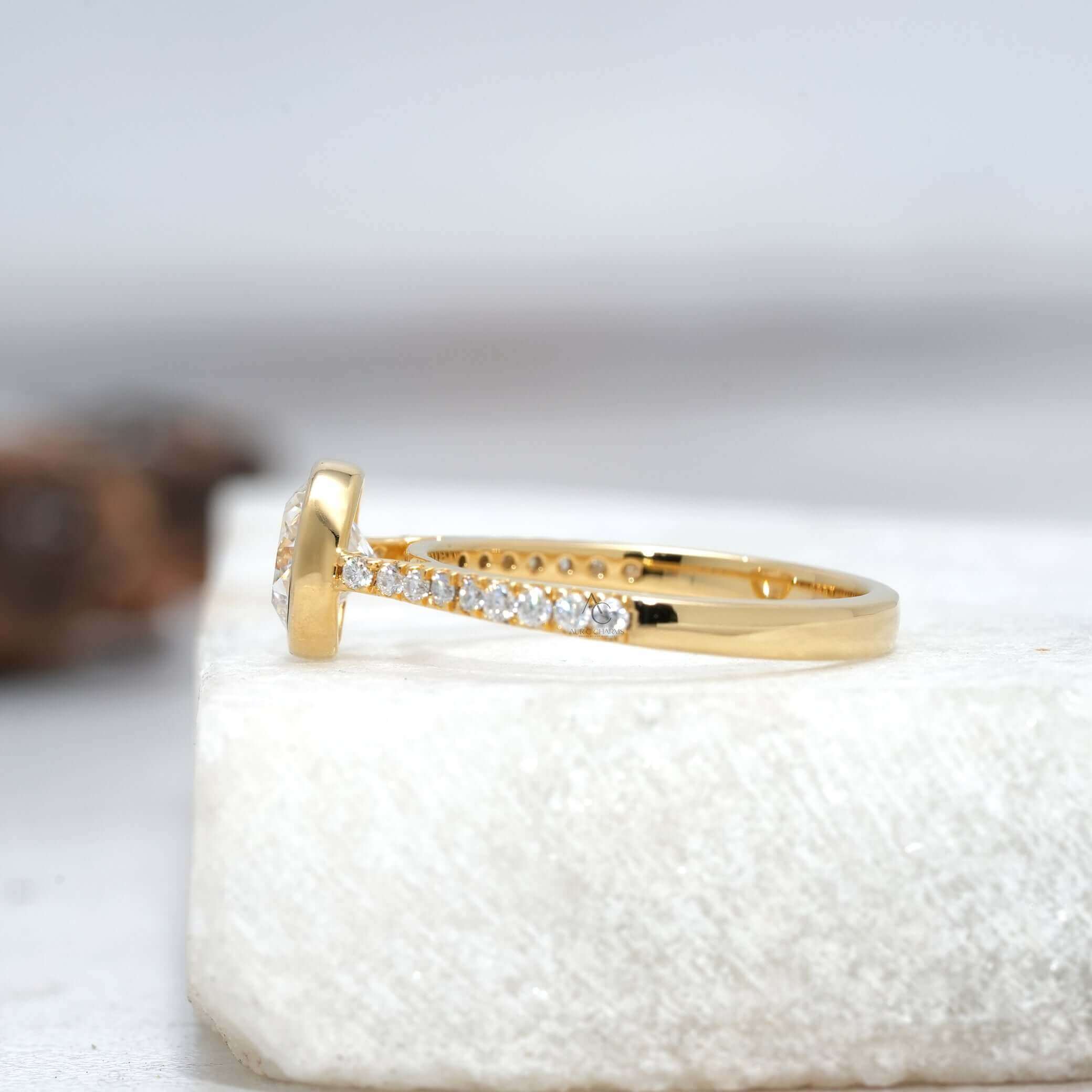 Rear view of bezel-set diamond ring highlighting the band design.