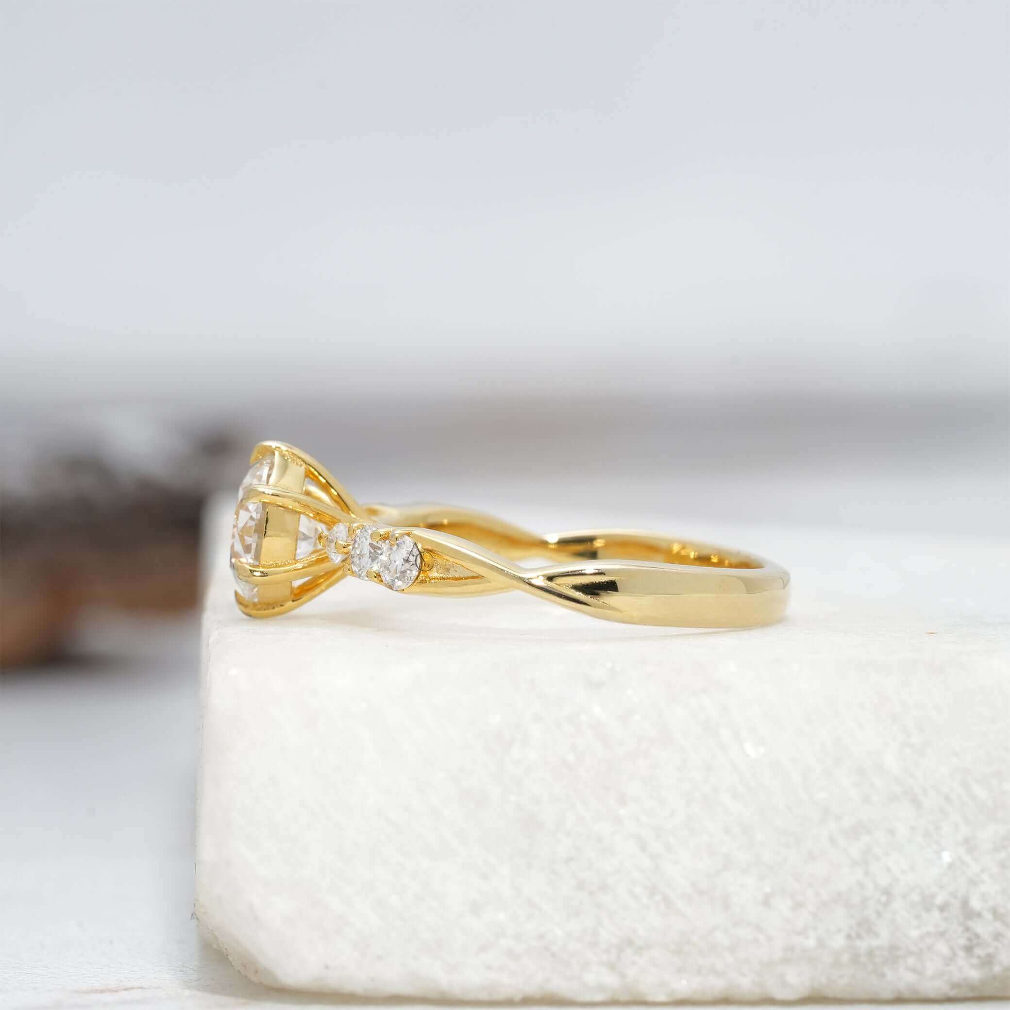 Side profile of round lab-grown diamond engagement ring showcasing pave-set shank design.