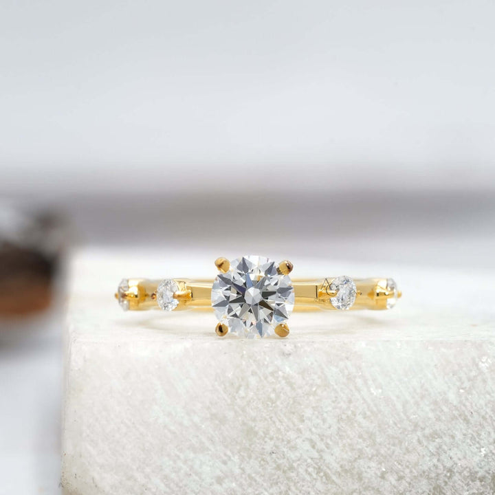 Round-cut diamond ring in white gold with reflective brilliance and sleek design.