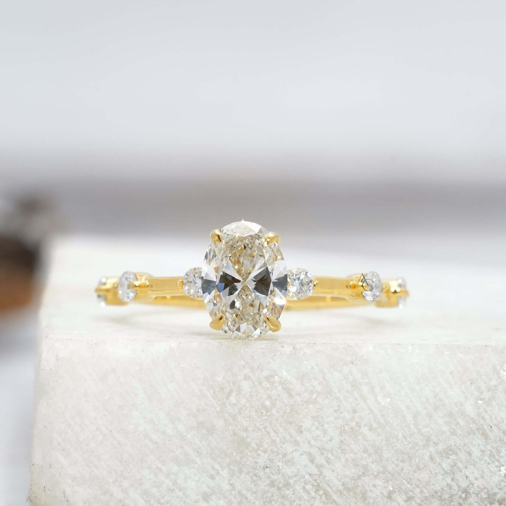 Oval-cut diamond engagement ring with delicate accents, reflecting timeless elegance.