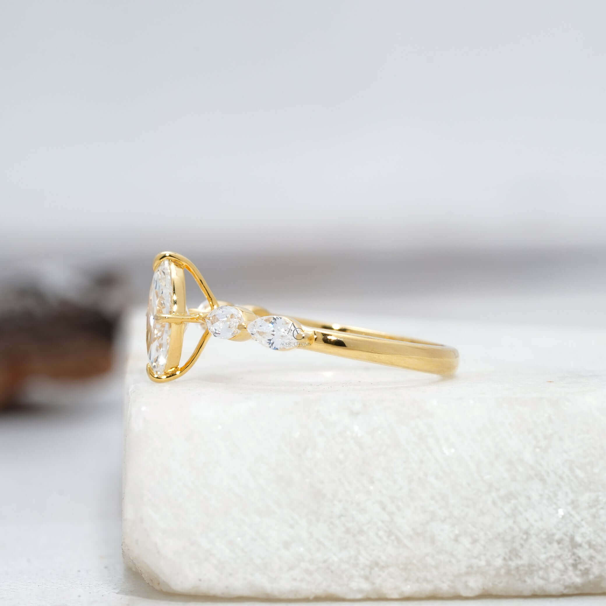 Side view of marquise-cut diamond ring showing prong setting.