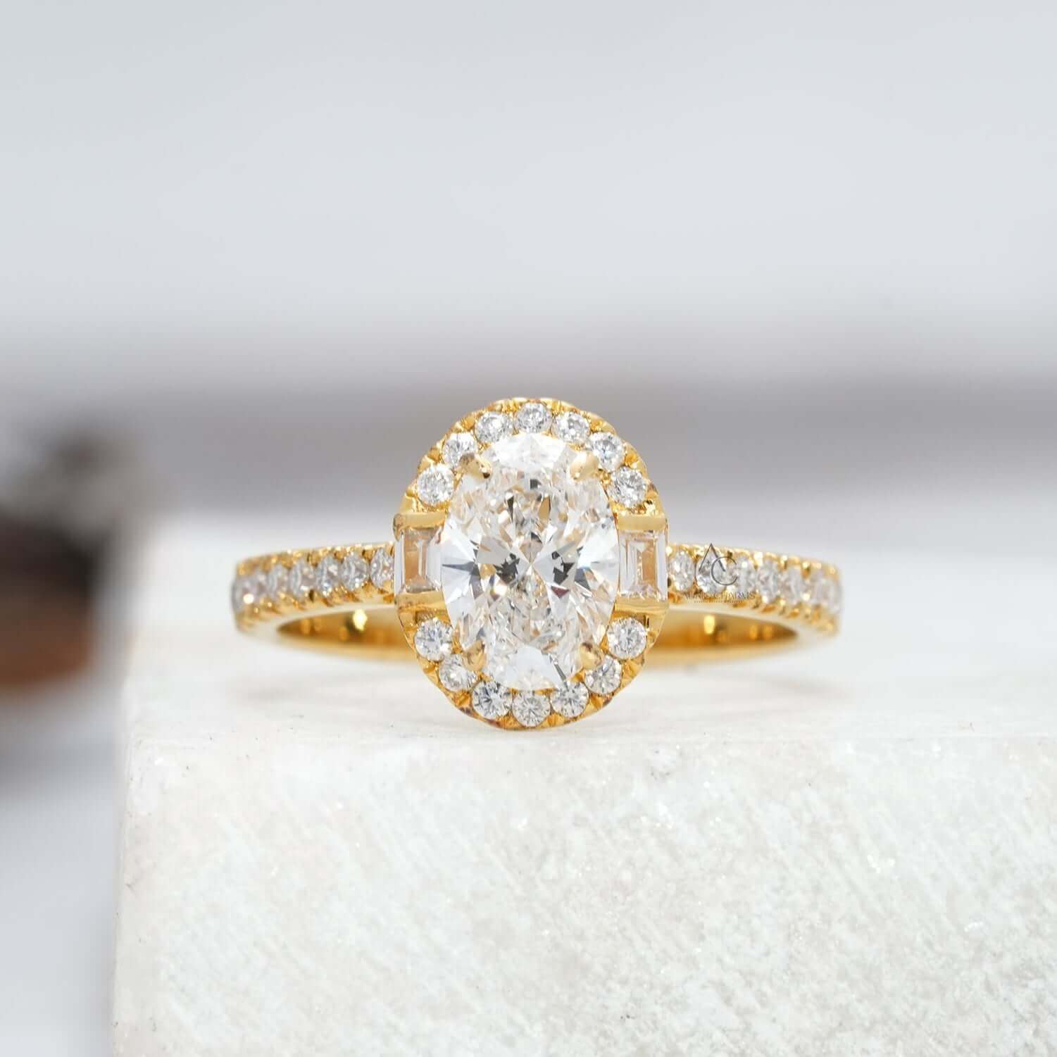 Oval diamond engagement ring with halo and pave band.