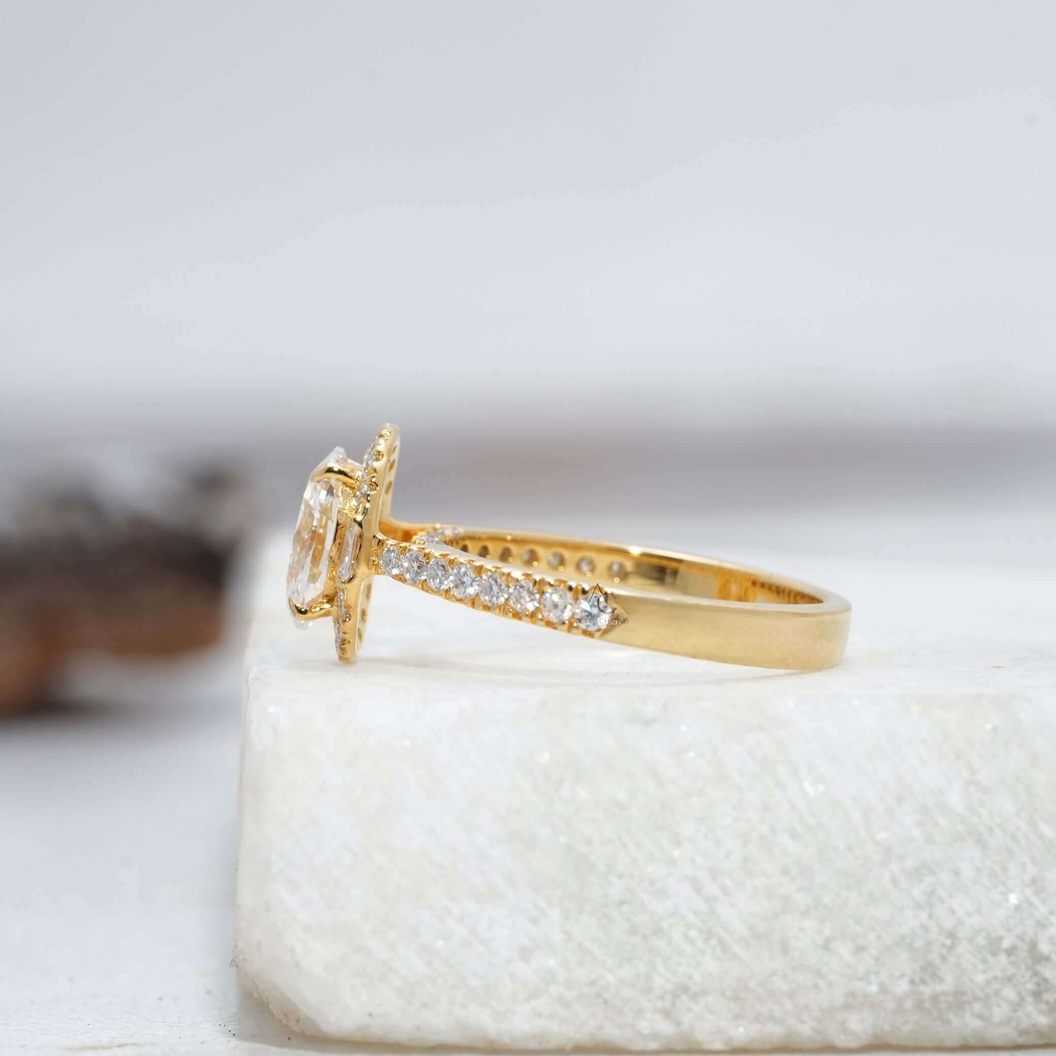 Angled side view of oval diamond ring with baguette and pave band.