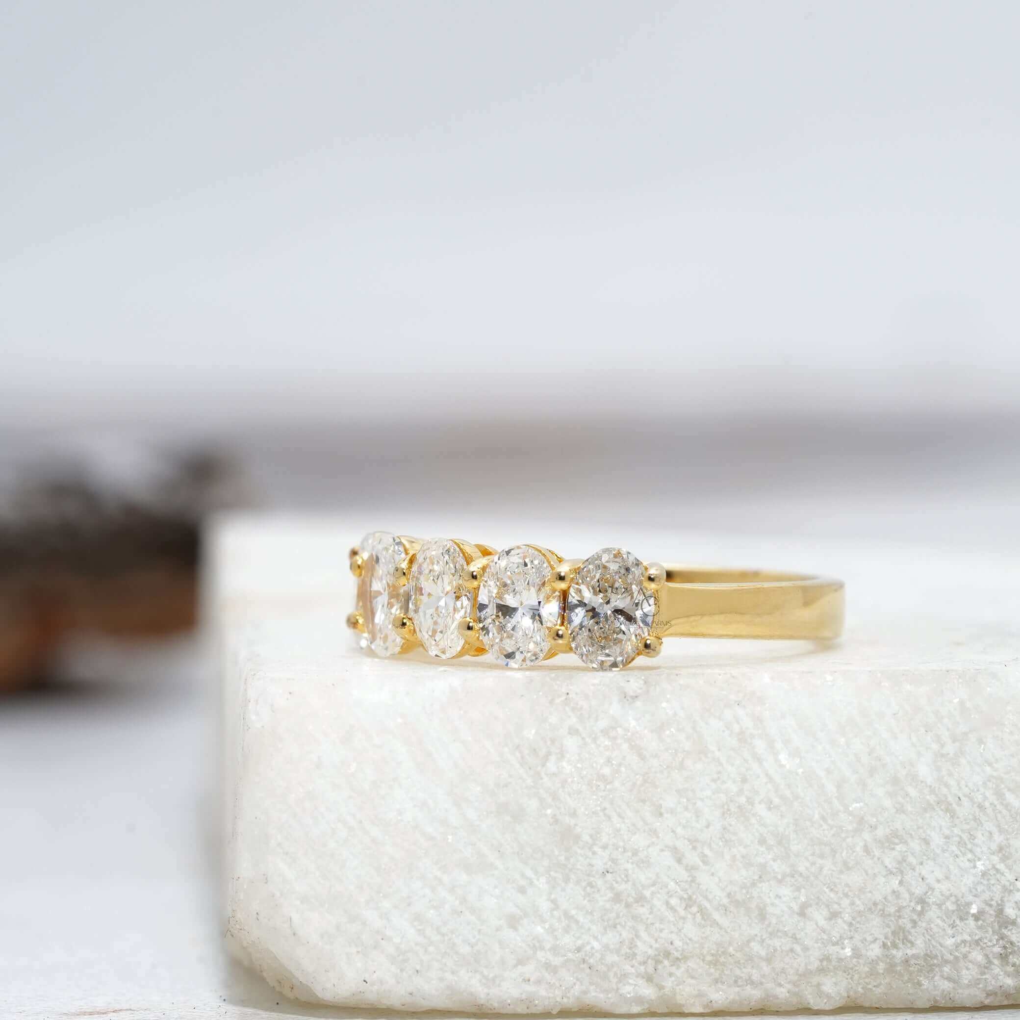 Five-stone diamond band ring featuring brilliant oval lab-grown diamonds in white gold.