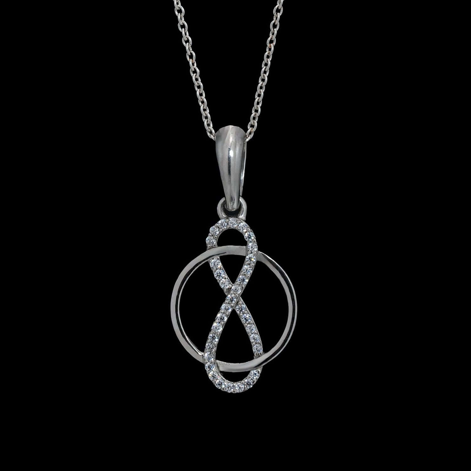 Infinity circle pendant necklace in silver, adorned with lab-grown diamonds, symbolizing eternal love, worn on neck.