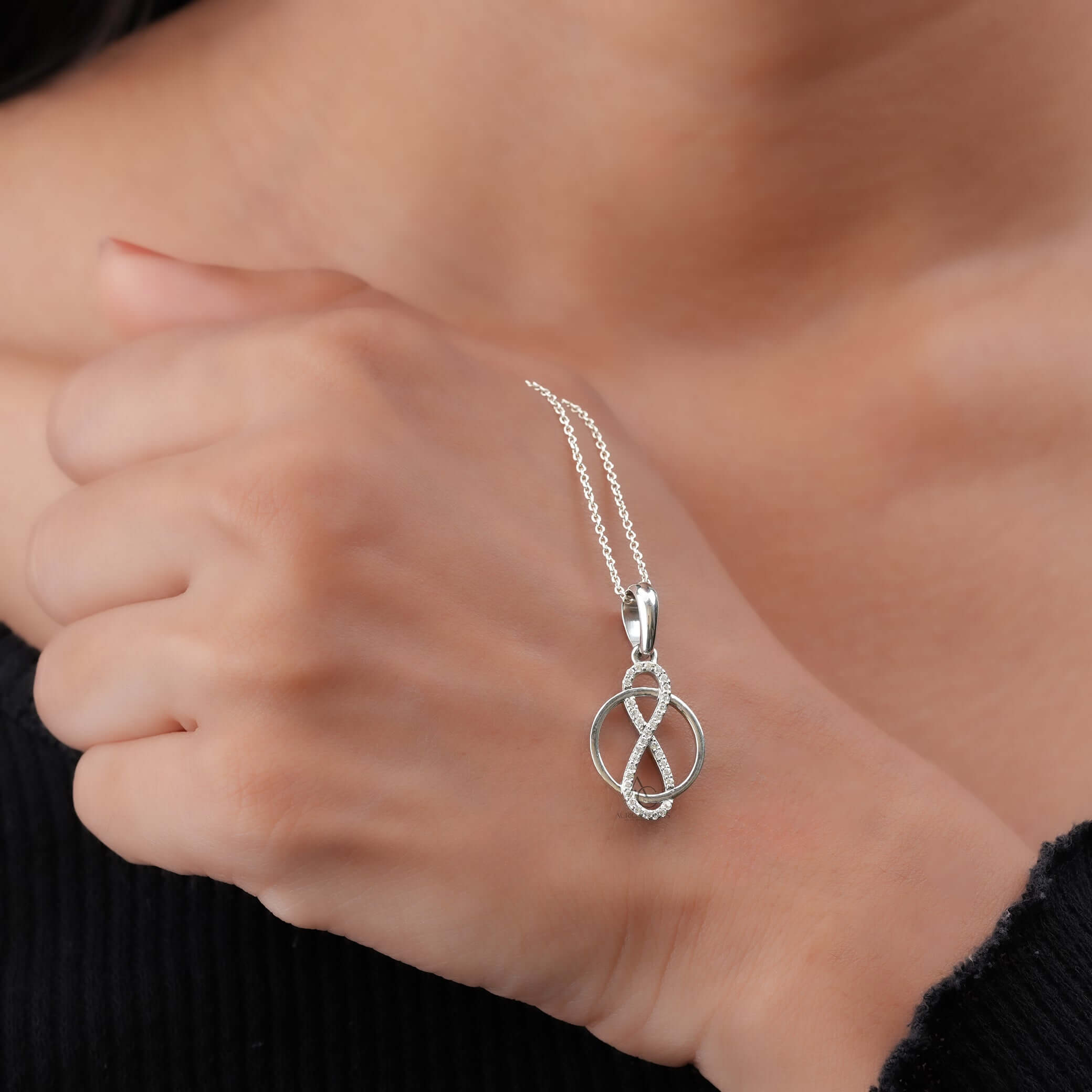 Elegant infinity circle pendant necklace featuring lab-grown diamonds, beautifully worn on the neck for luxury and timeless style.