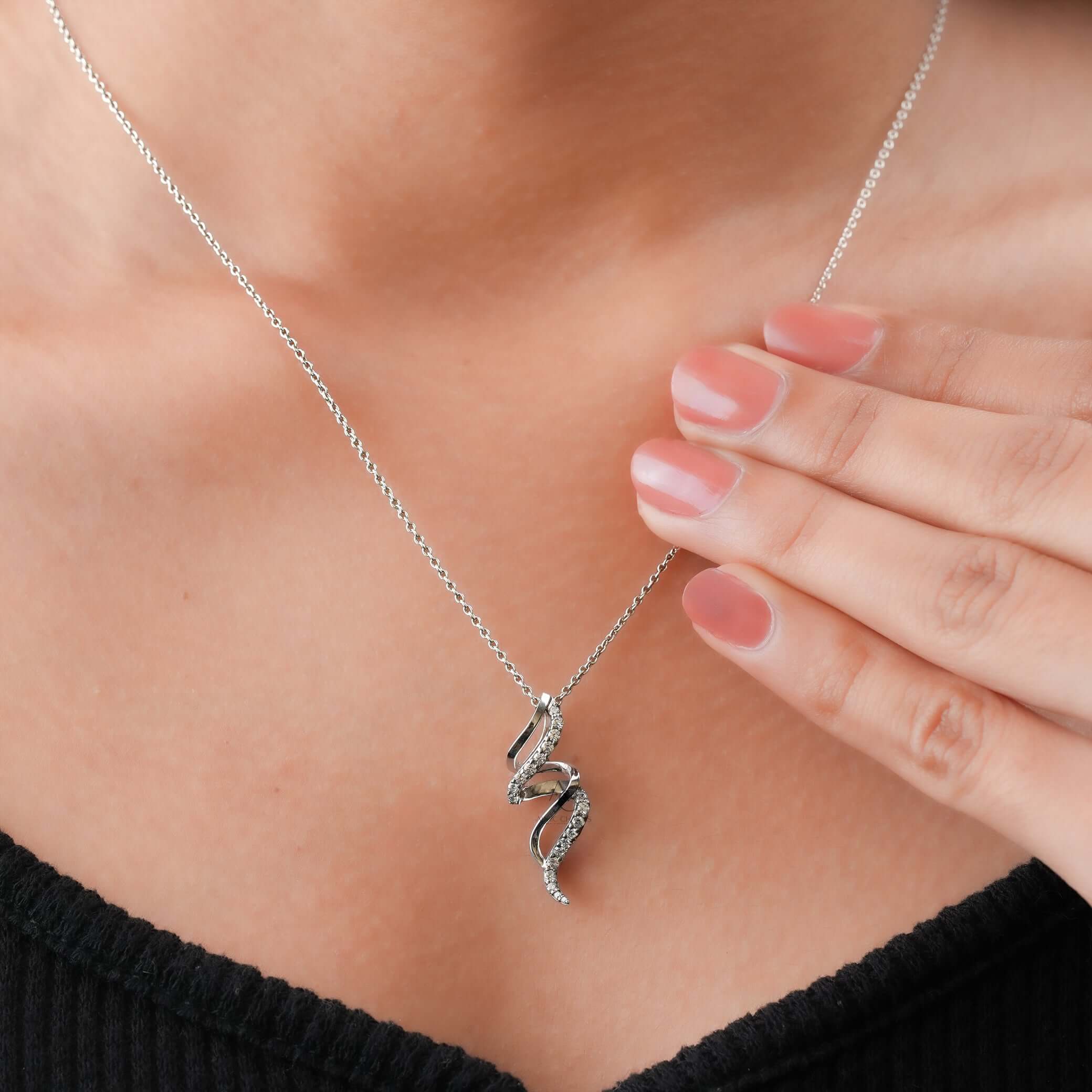 Lab grown diamond spiral pendant necklace worn elegantly on neck, showcasing its sustainable luxury and fine jewelry appeal.