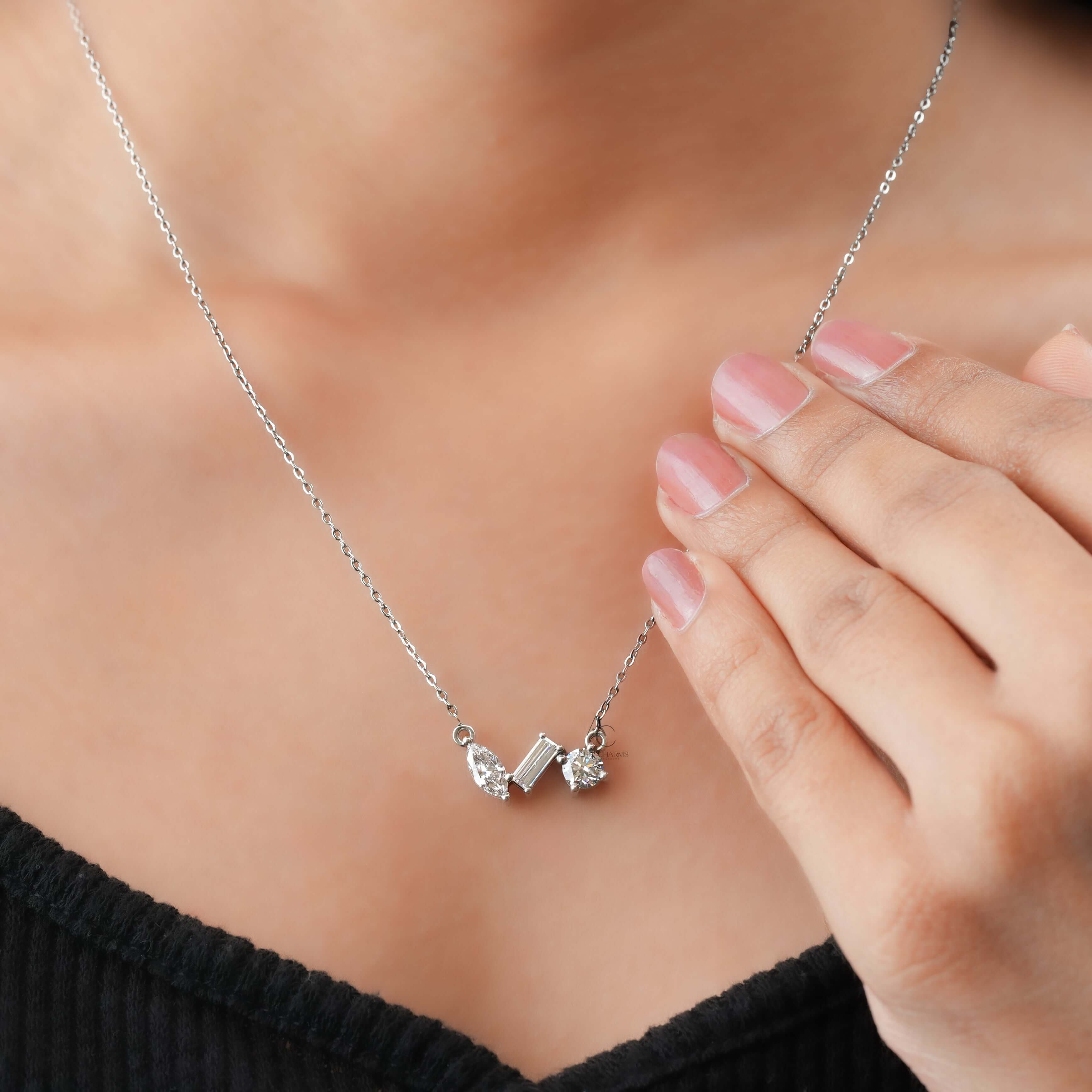 A stunning lab-grown diamond trio pendant necklace, elegantly worn on the neck, showcasing its brilliant cuts and luxury design.