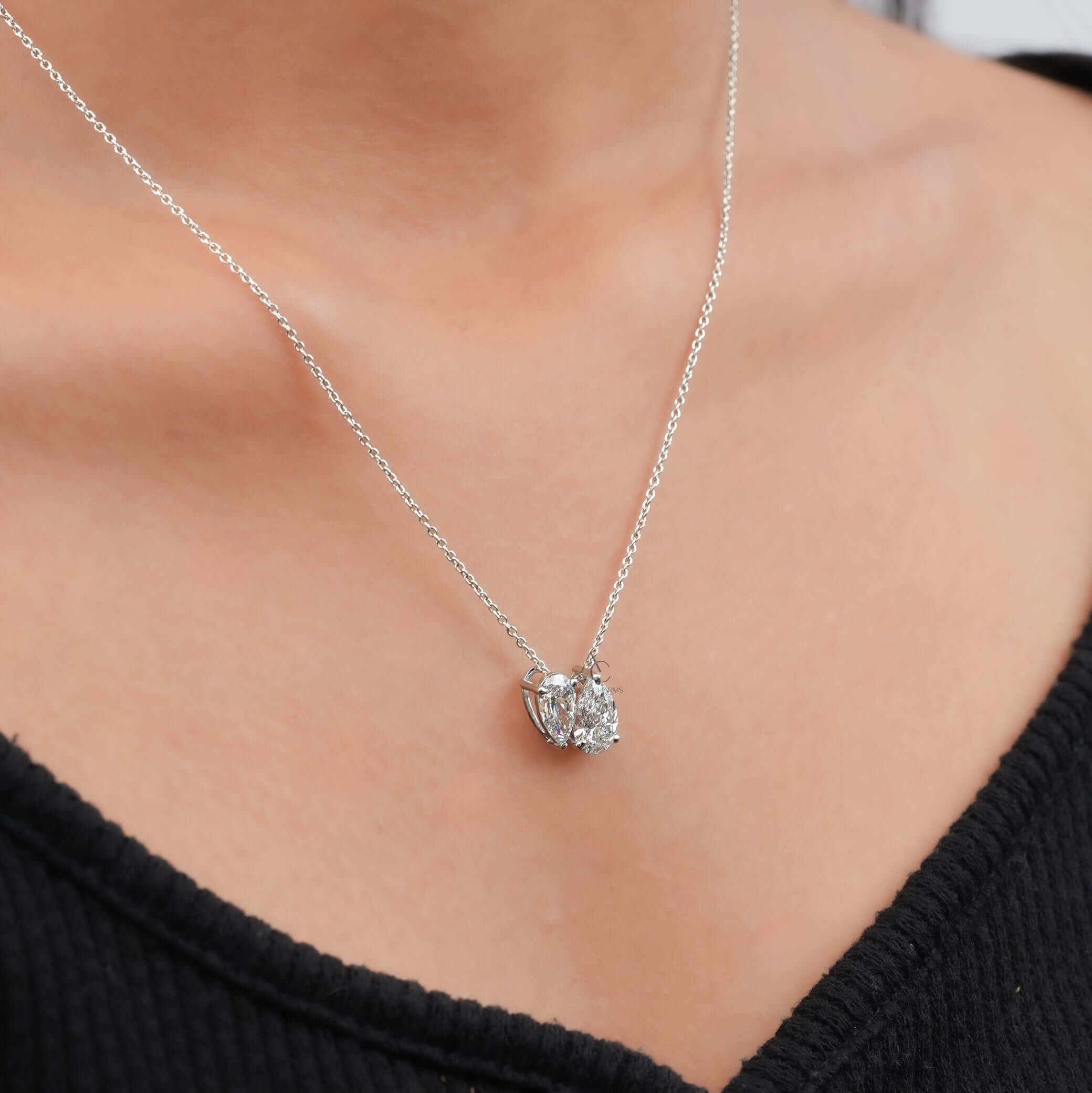 Toi et Moi pendant necklace with pear-cut lab-grown diamonds, elegantly worn on neck, showcasing luxury and sustainable jewelry.