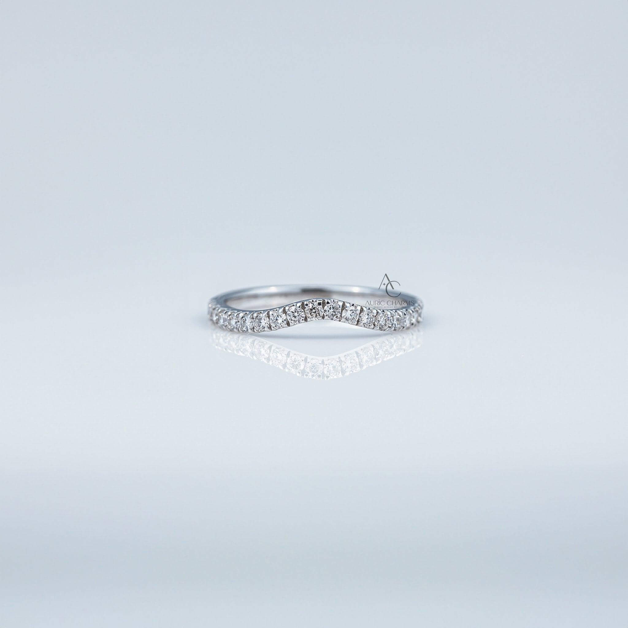 Elegant wavy diamond band in sterling silver, perfect for minimalist jewelry enthusiasts.