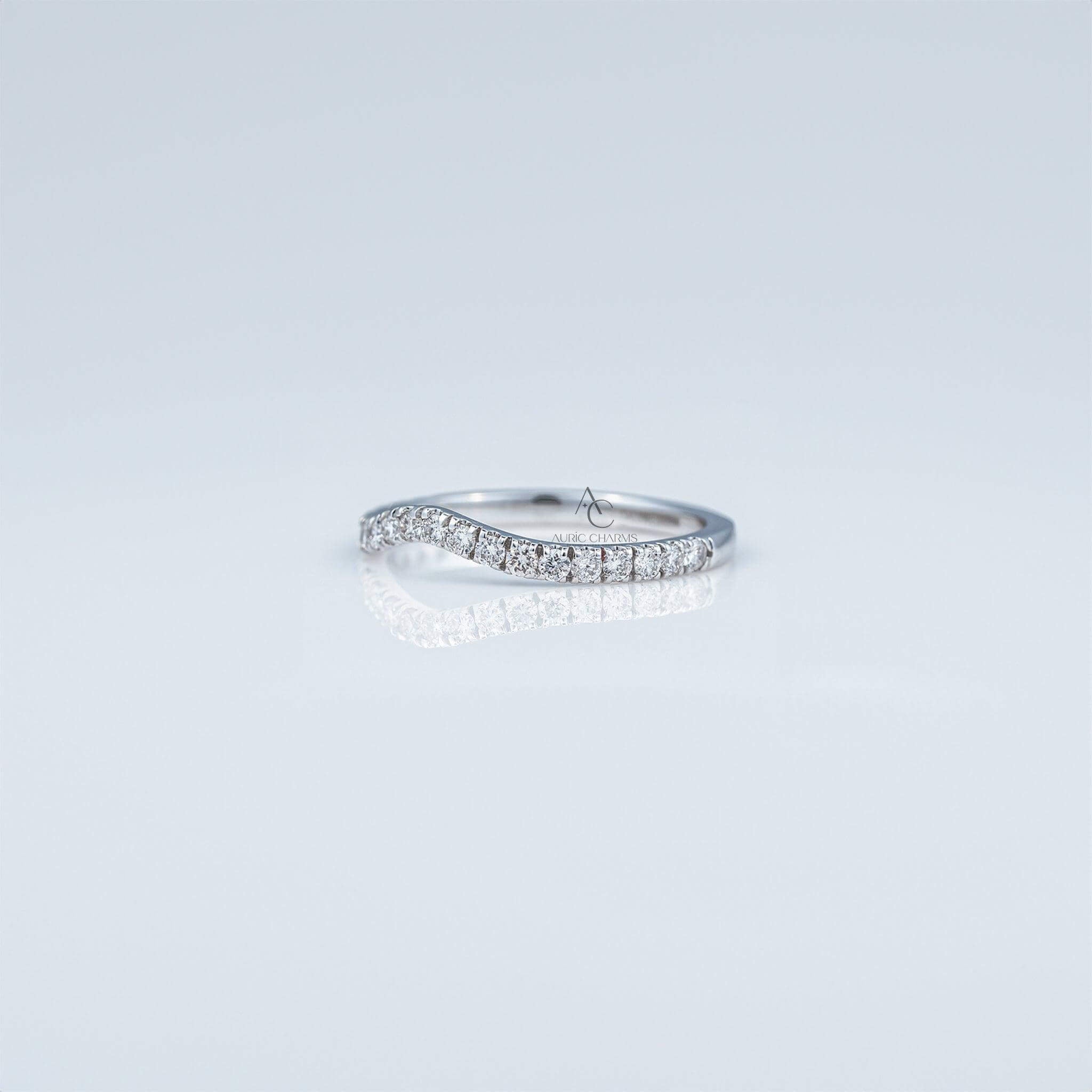 Delicate wave-shaped diamond ring, a modern touch of luxury and style.