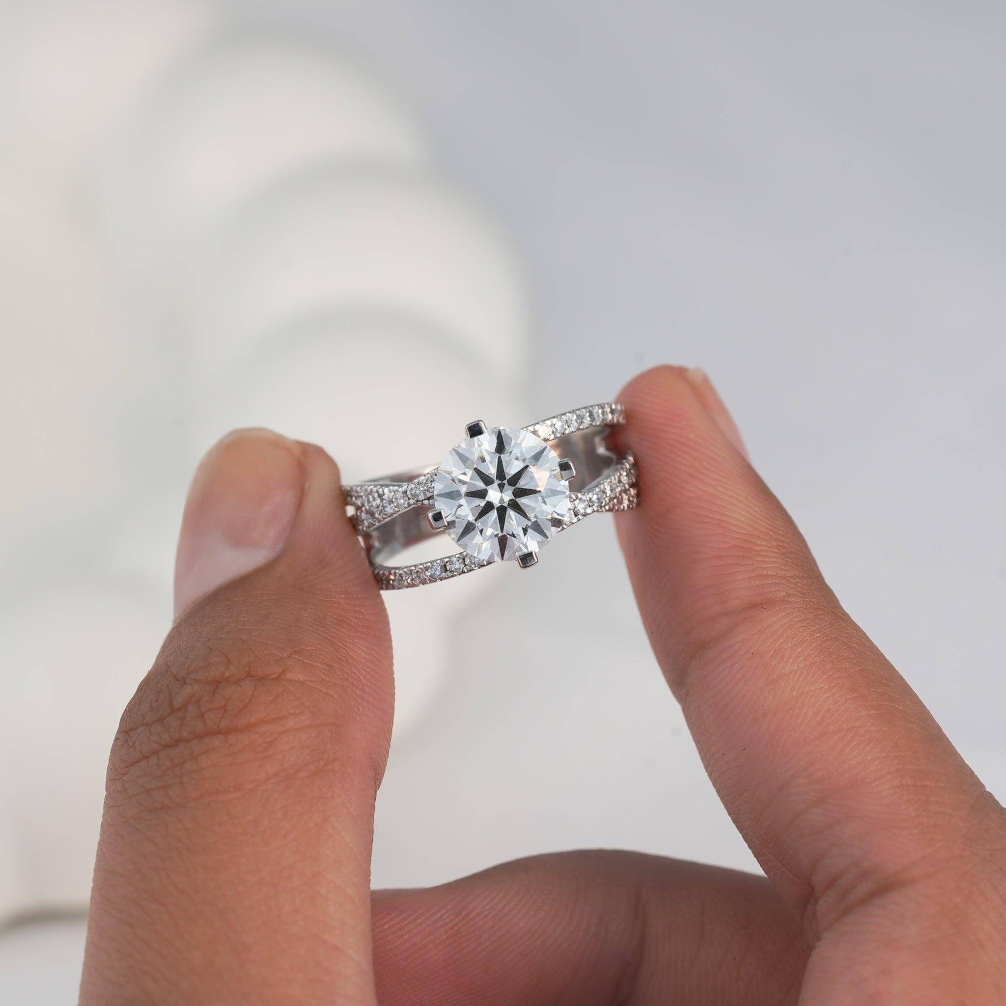 Close-up of a luxurious diamond ring with a modern split-shank design for bridal collections.