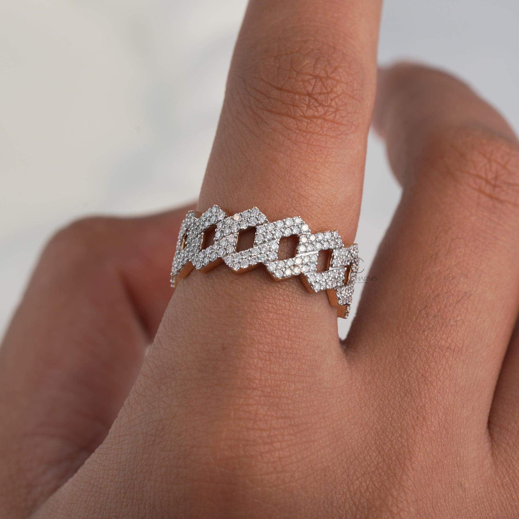 Diamond-studded zigzag band on a hand showcasing intricate geometric design.