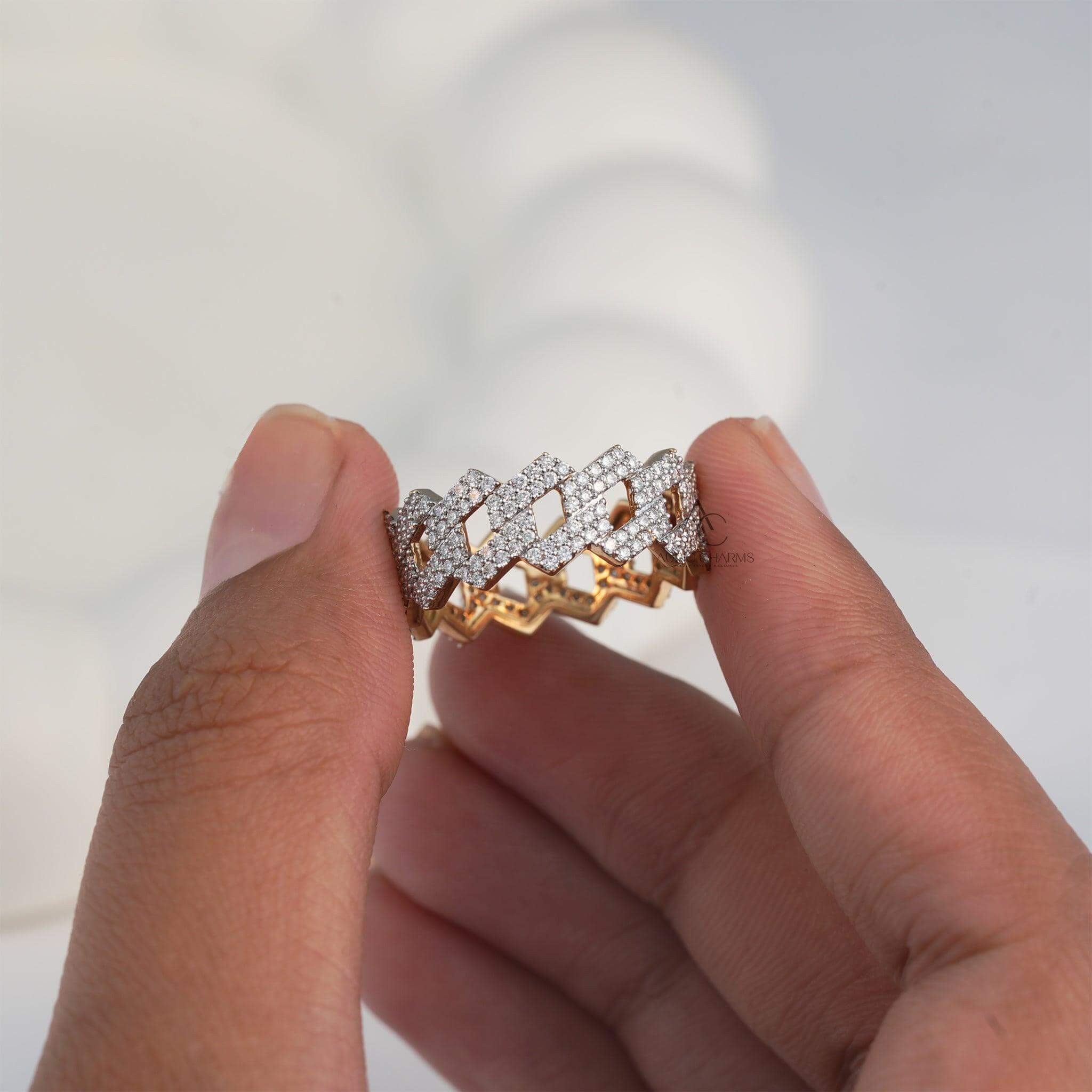 Close-up of a gold and diamond zigzag ring, highlighting its elegant geometric pattern.