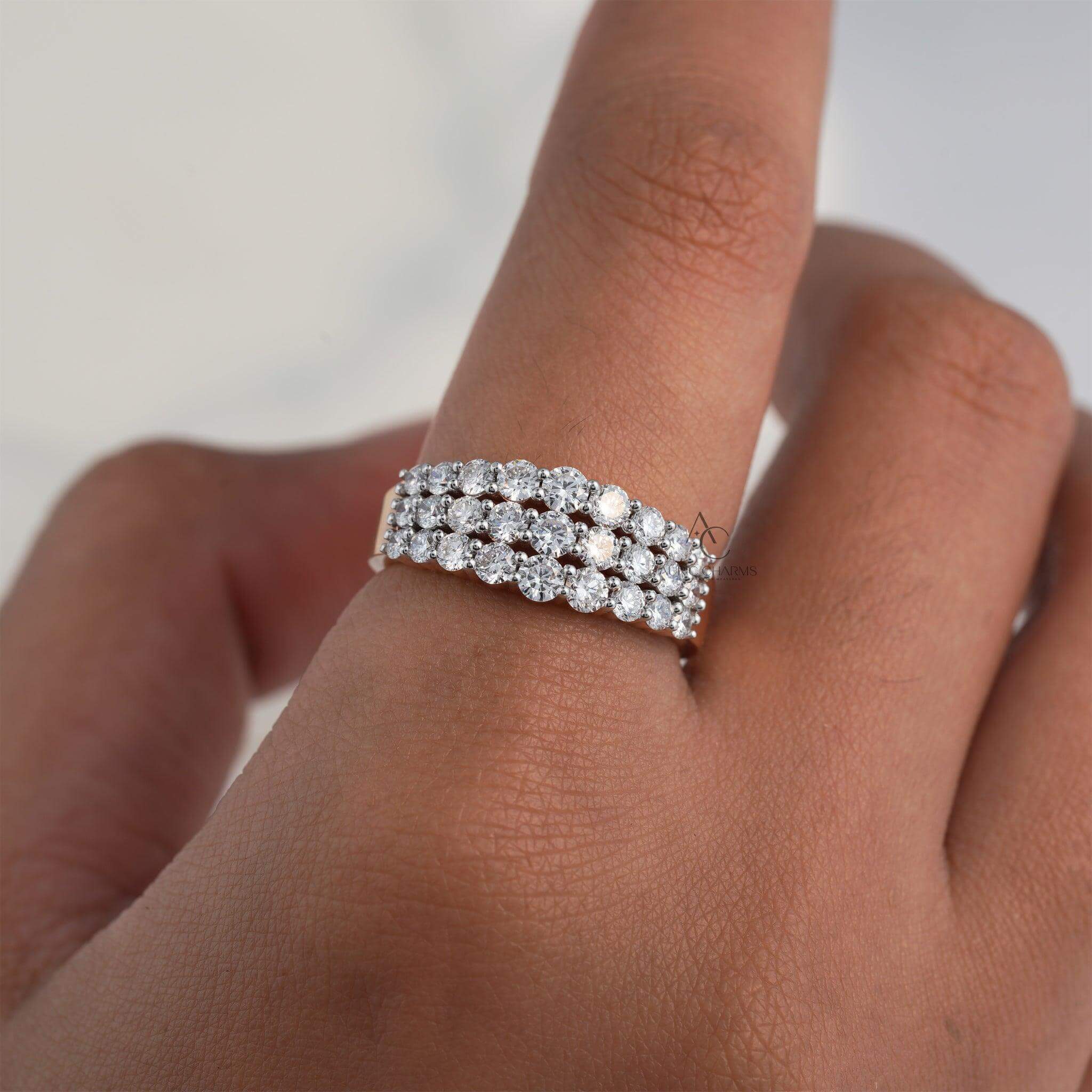 Three-row diamond ring on finger, featuring dazzling lab-grown diamonds.