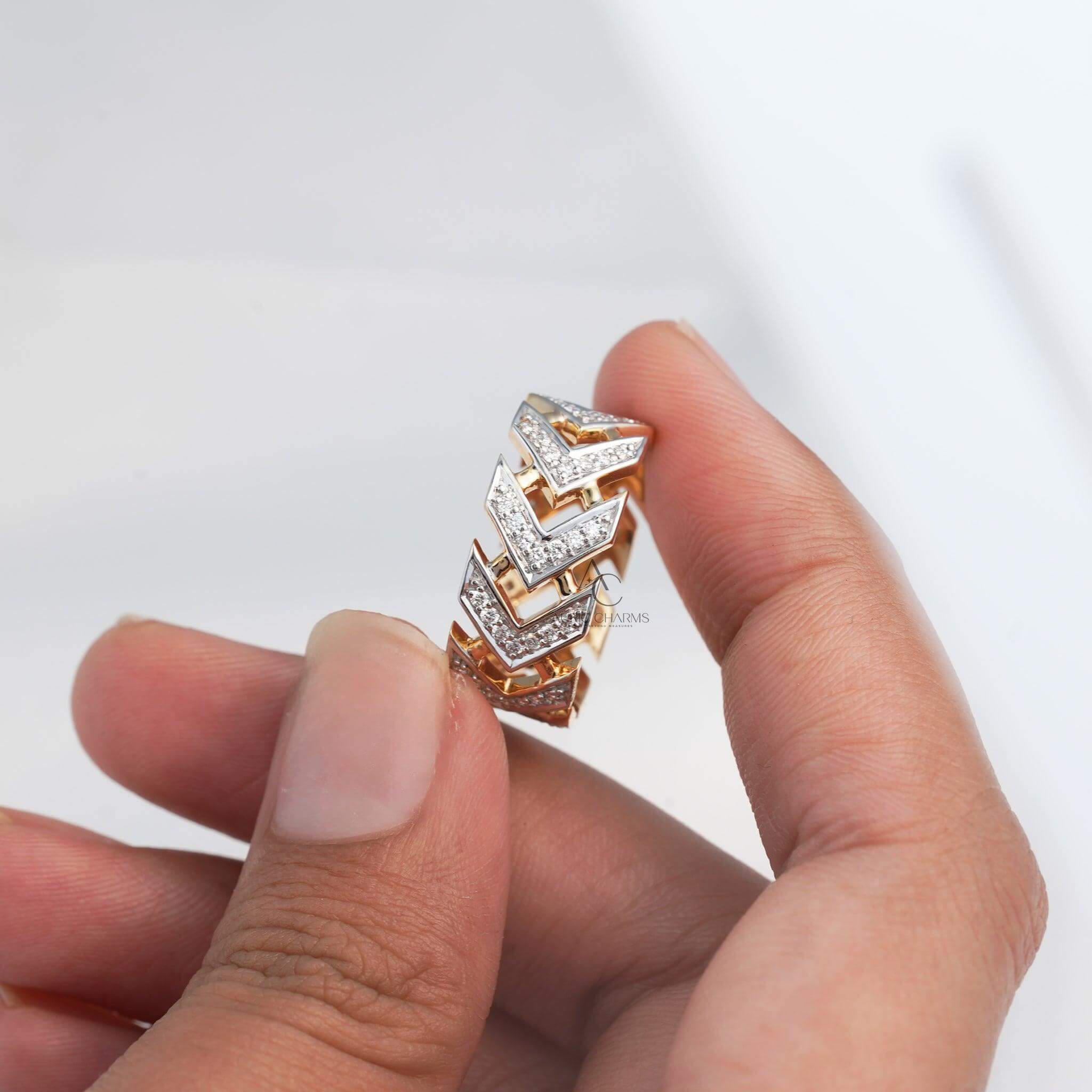 Close-up of chevron design diamond ring in gold with lab-grown diamonds.