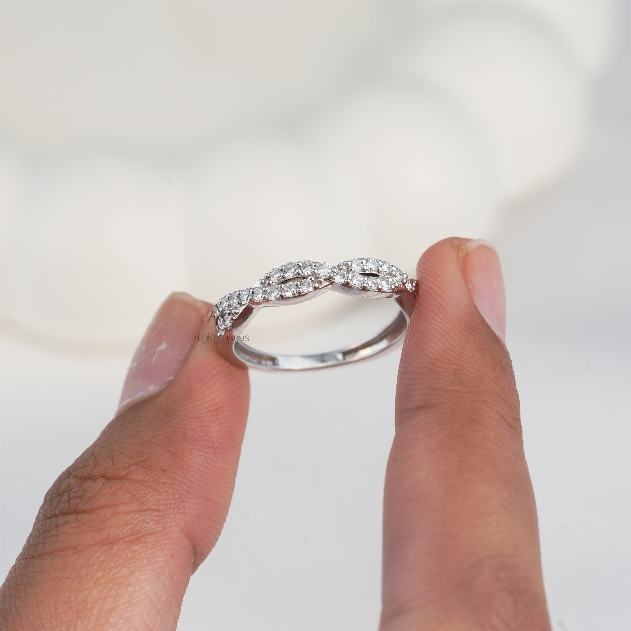 Close-up of a diamond ring with intricate braiding, showcasing exquisite craftsmanship.