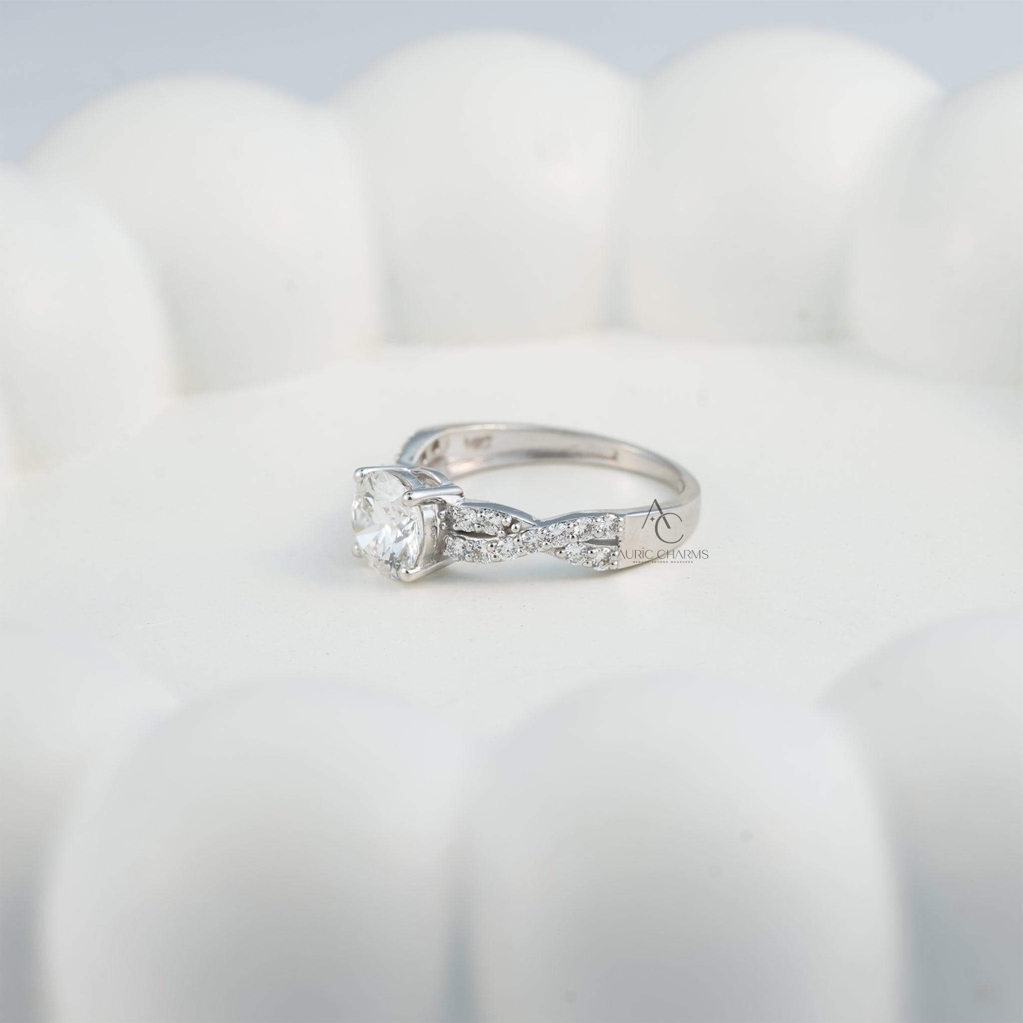 Solitaire diamond engagement ring displayed on a hand with a twisted diamond band.