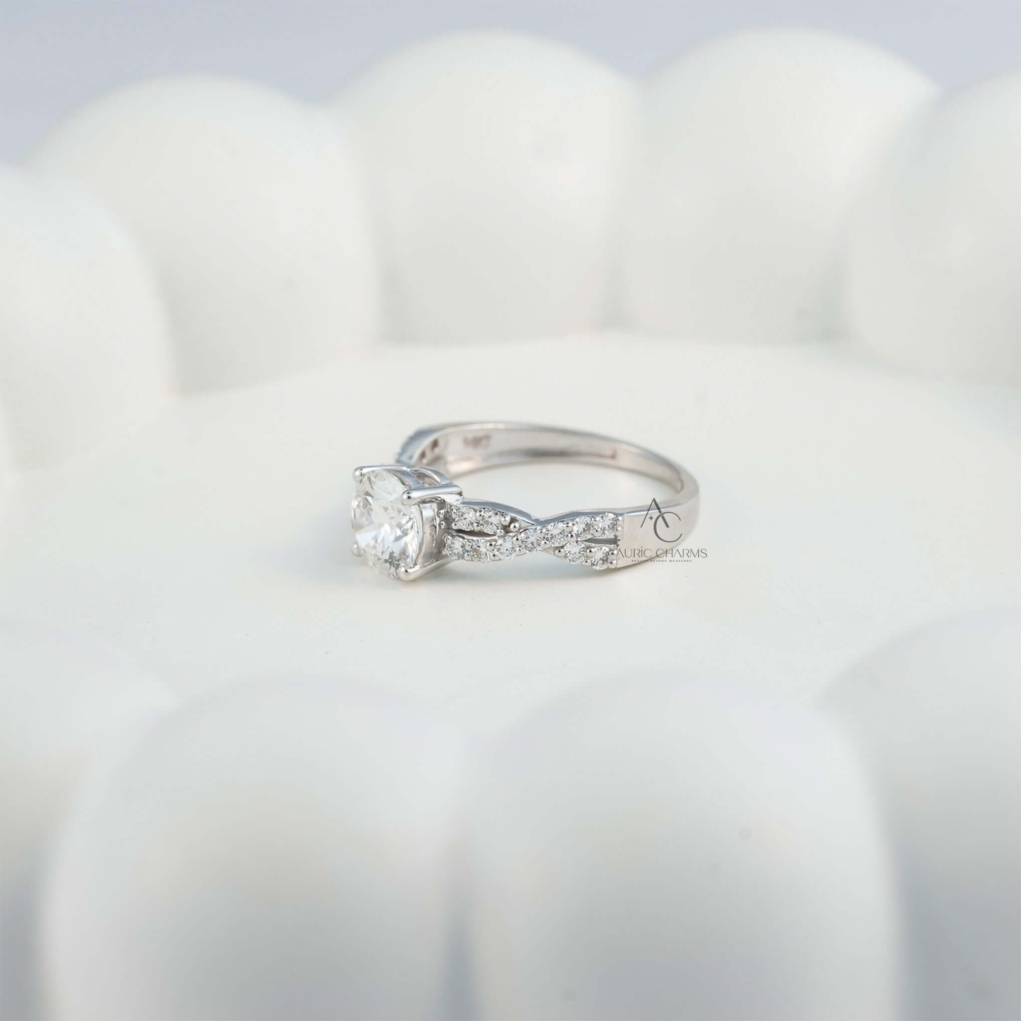 Elegant diamond ring with twisted pave band, shown from a low angle.