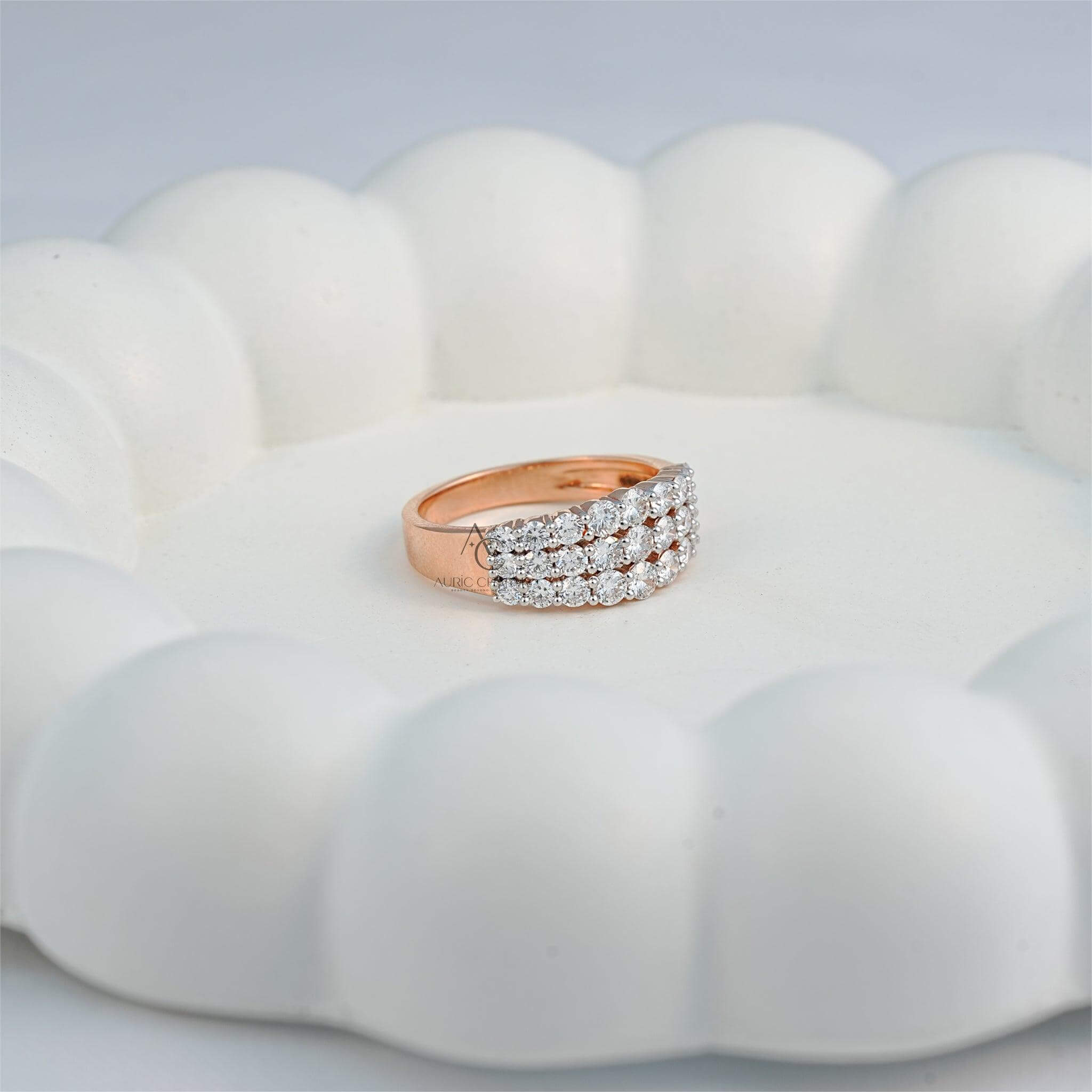 elegant three-row diamond ring on a decorative surface